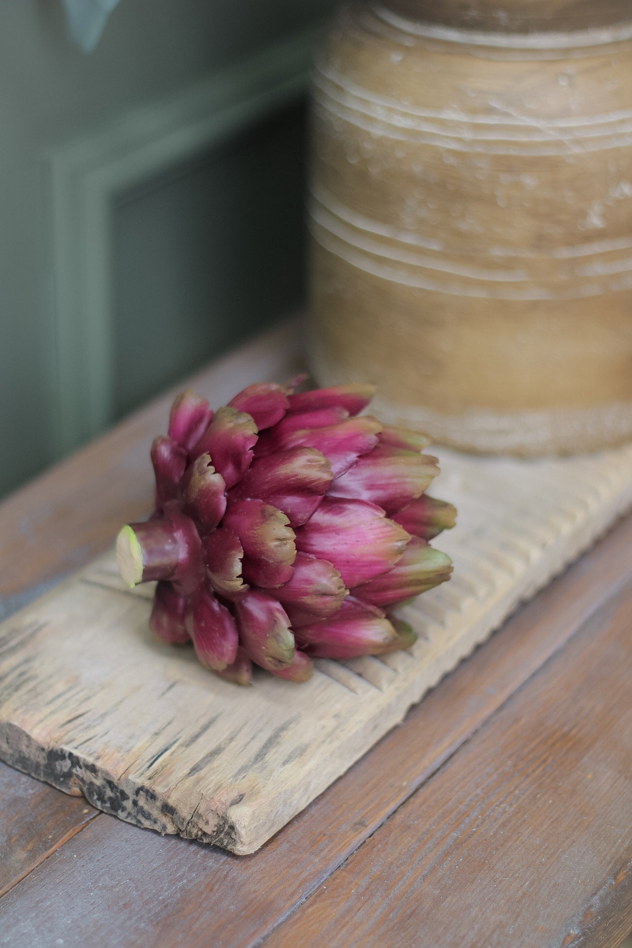 Faux purple artichoke on vintage wooden washboard