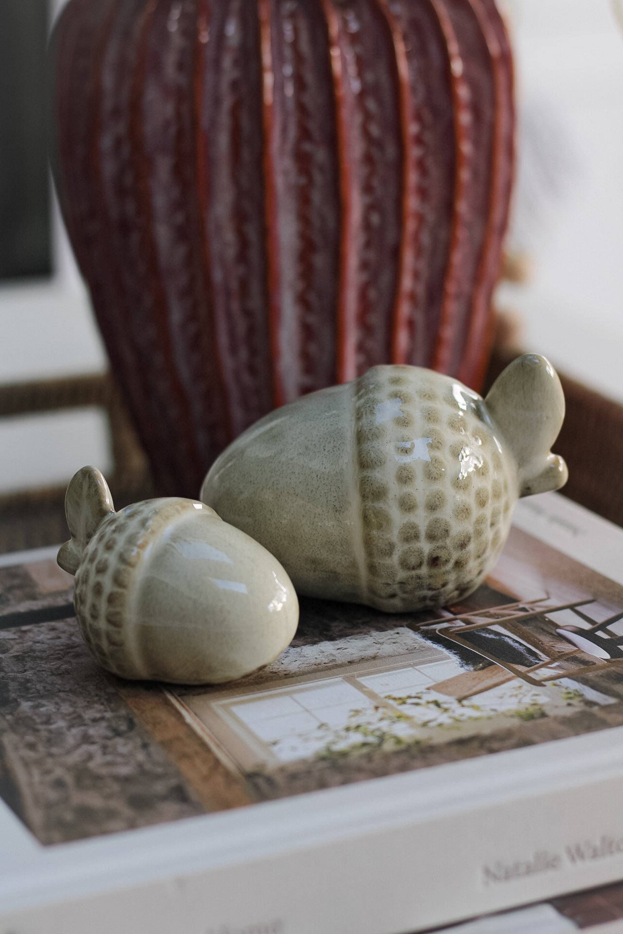 set of two glazed ceramic acorns