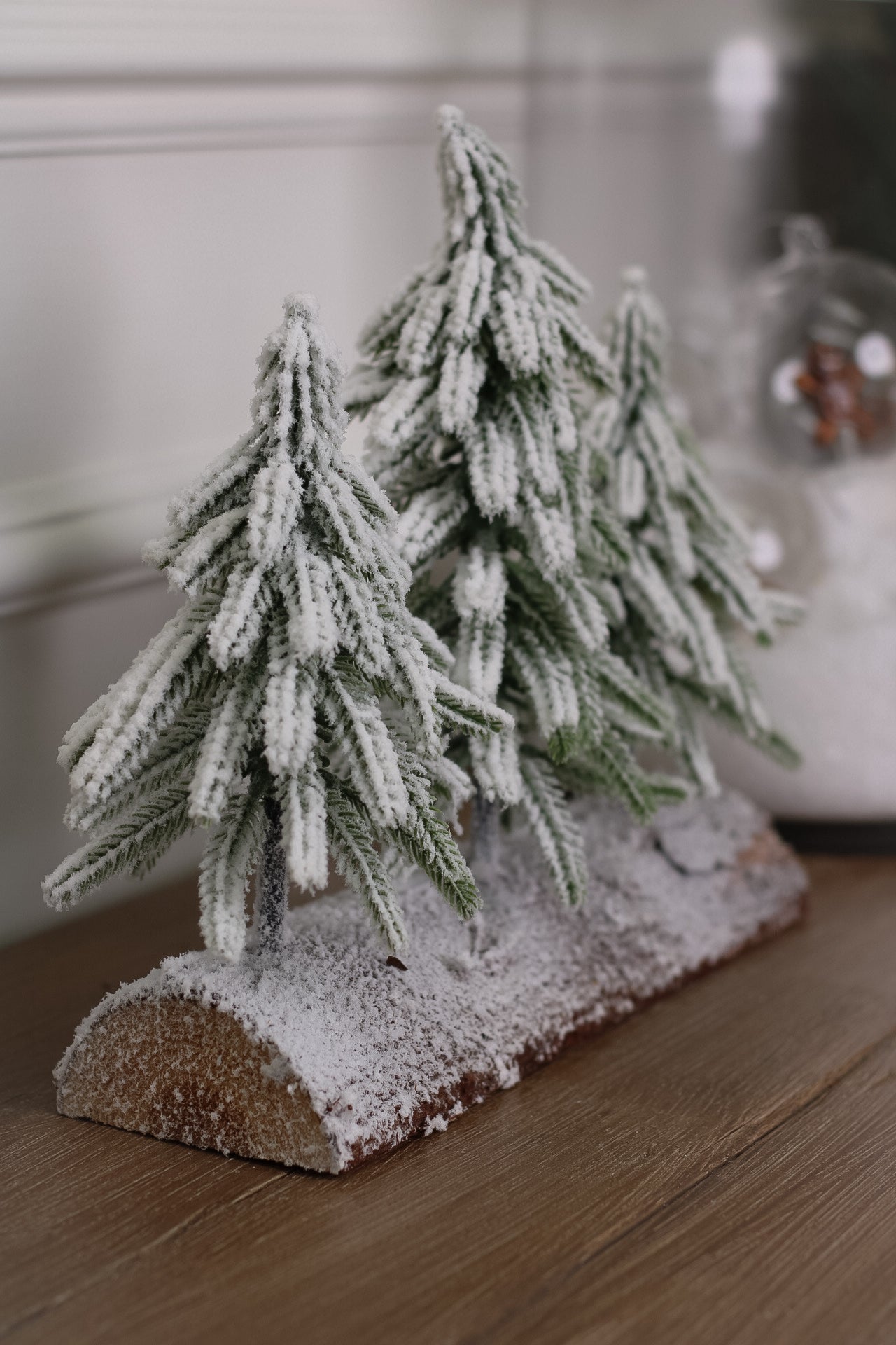 Snowy Faux Christmas Trees on a Rustic Log
