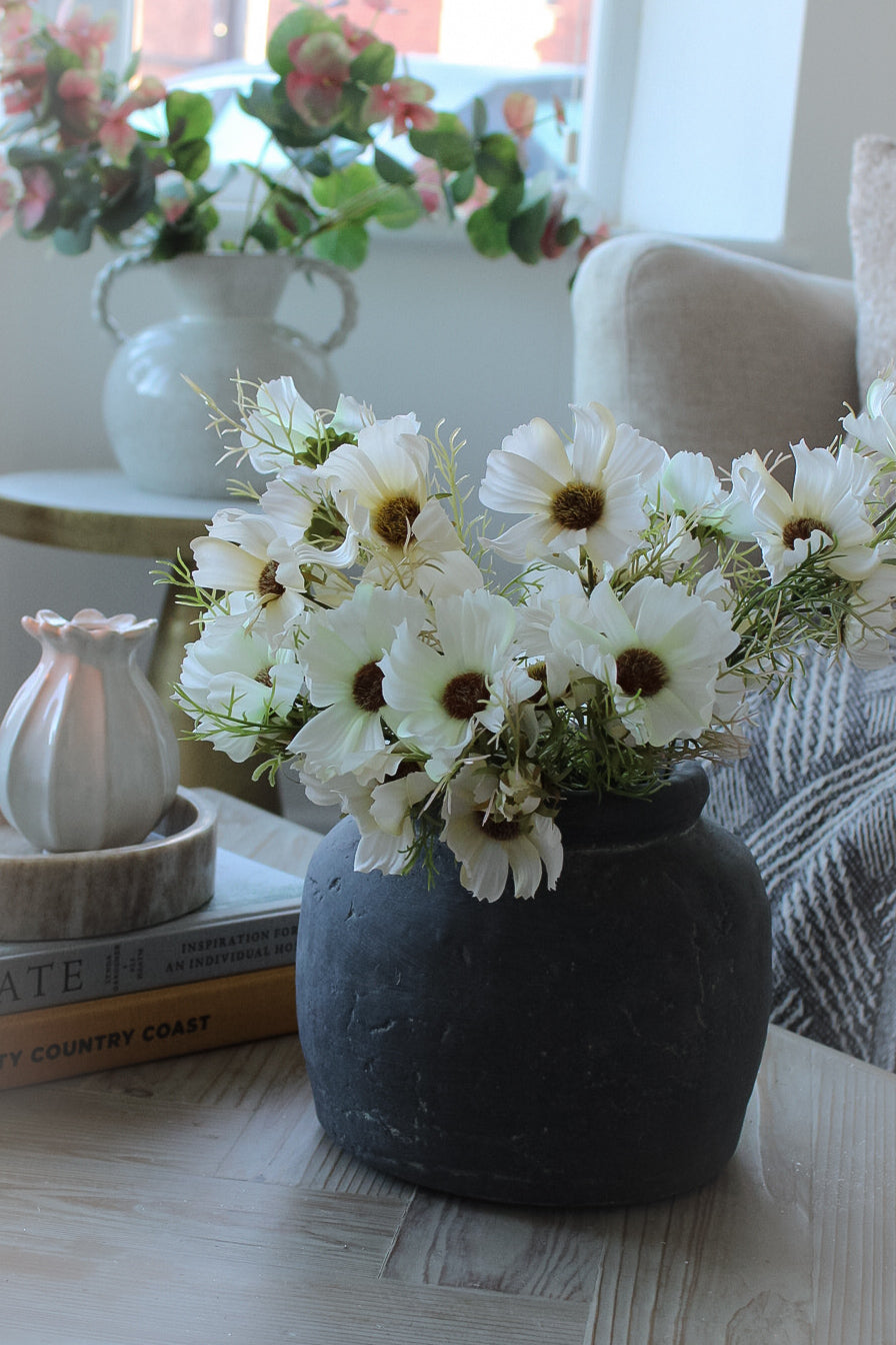 faux cream cosmos spray in black cement rustic pot vase
