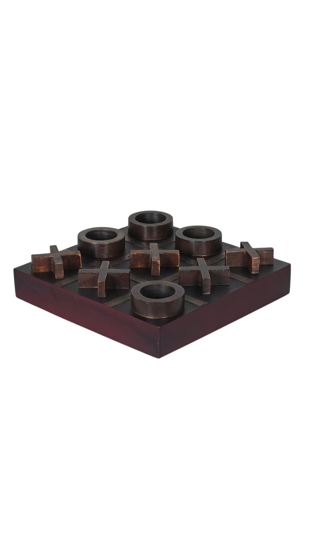 aged brass and wooden noughts and crosses game board with circular pegs on a white background