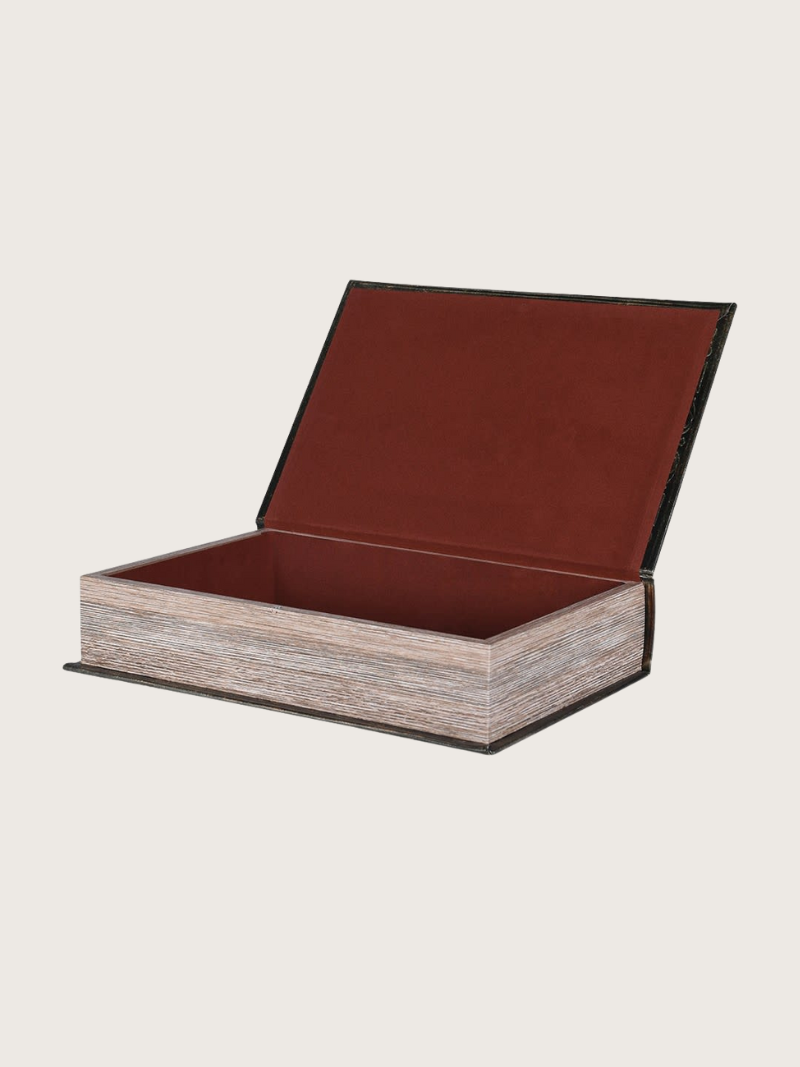Wooden box with a brown leather lid on a light beige background