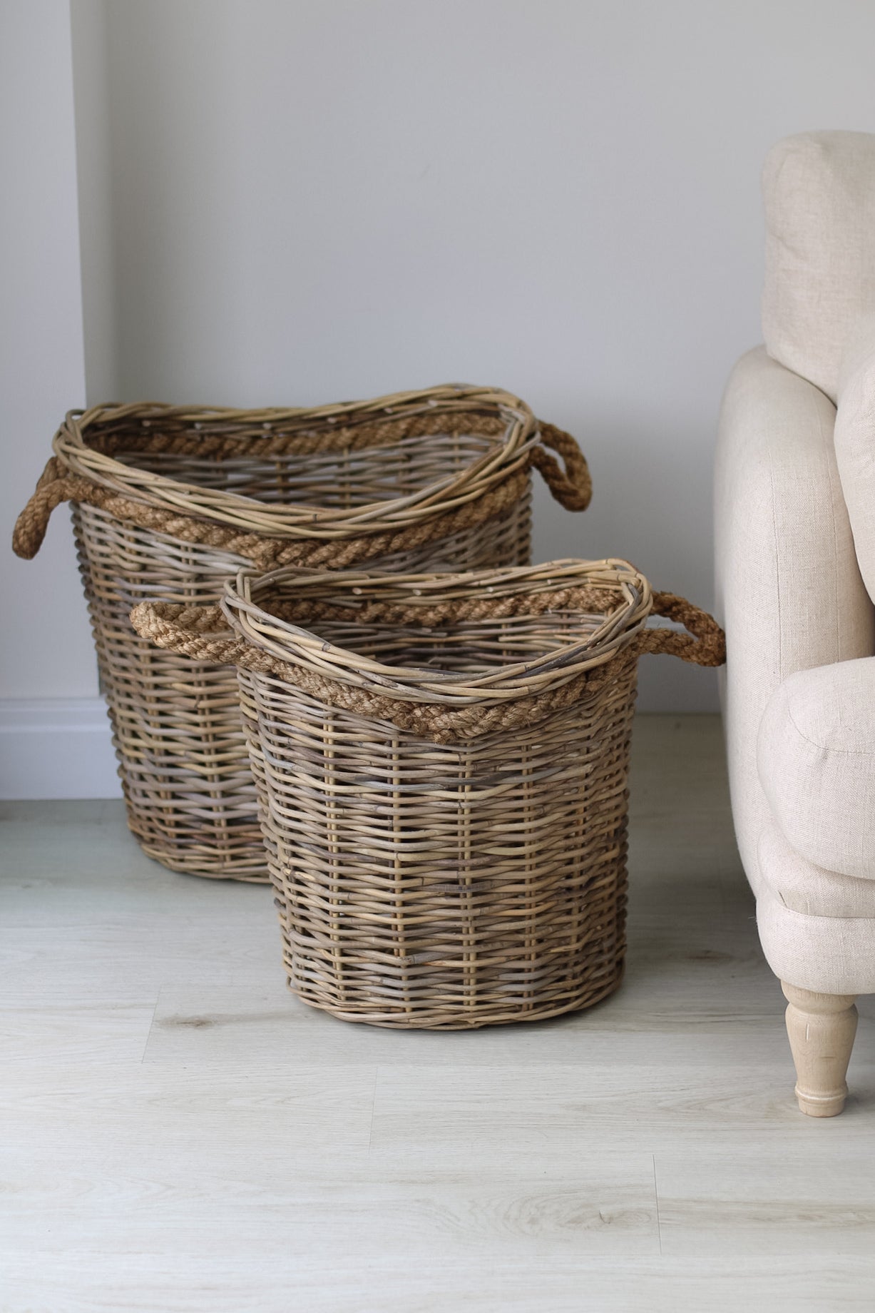 Bloomsbury Grey Washed Oval Rattan Basket with Rope Handles, perfect for filling with logs for your home decor