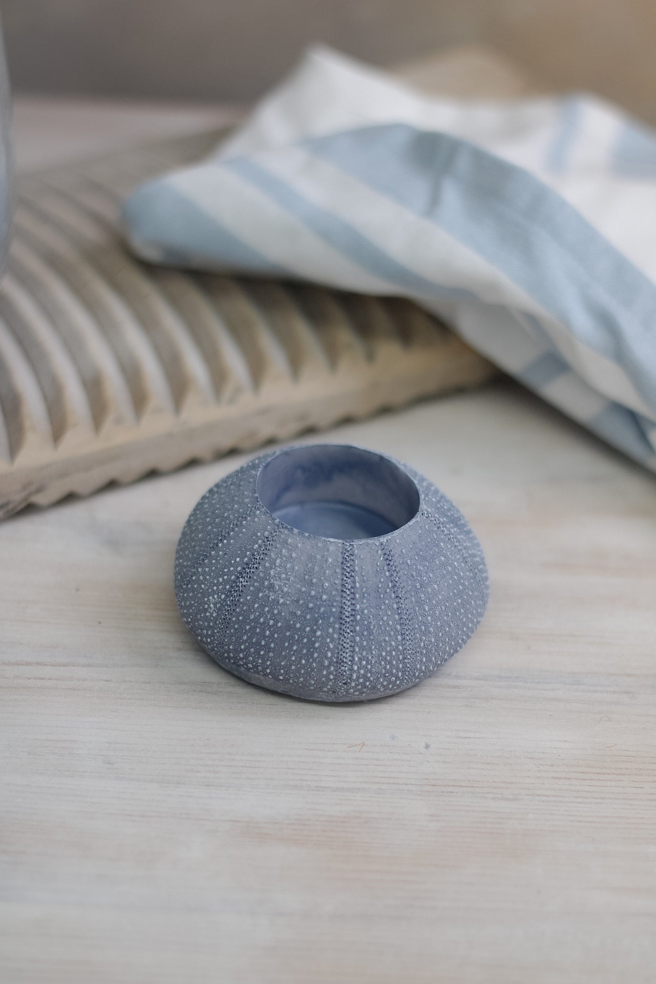 soft blue toned seaside inspired sea urchin candle holder