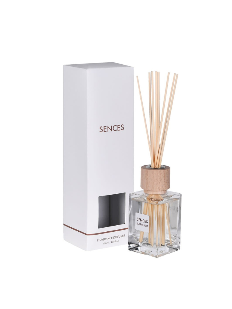 Sences diffuser bottle with wooden sticks and packaging on a white background