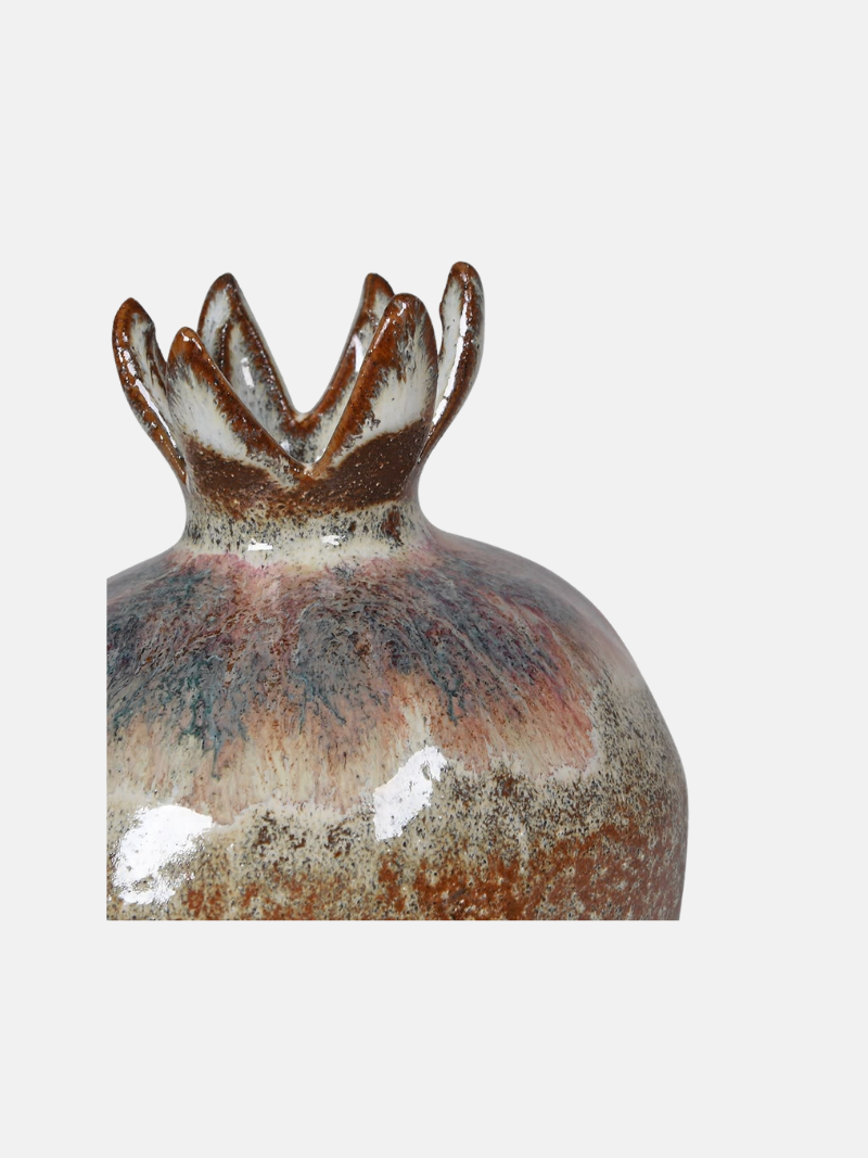 Decorative ceramic vase with unique design on a white background