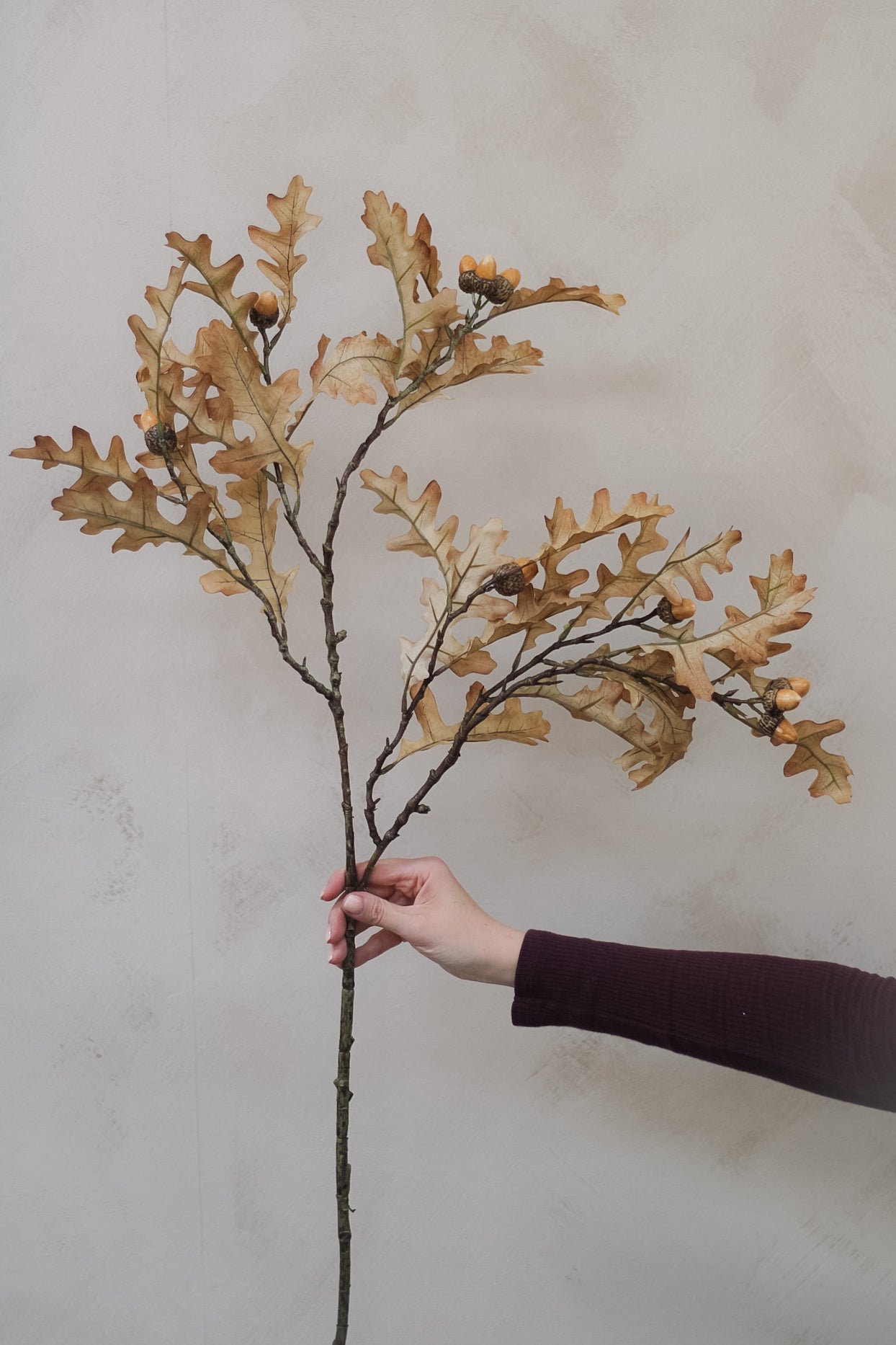 lifelike faux oak leaves and realistic acorns spray