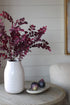 Faux Plum Mini Leaves Spray in distressed white ceramic vase