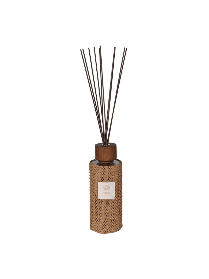Diffuser with rattan cover and wooden top on a white background
