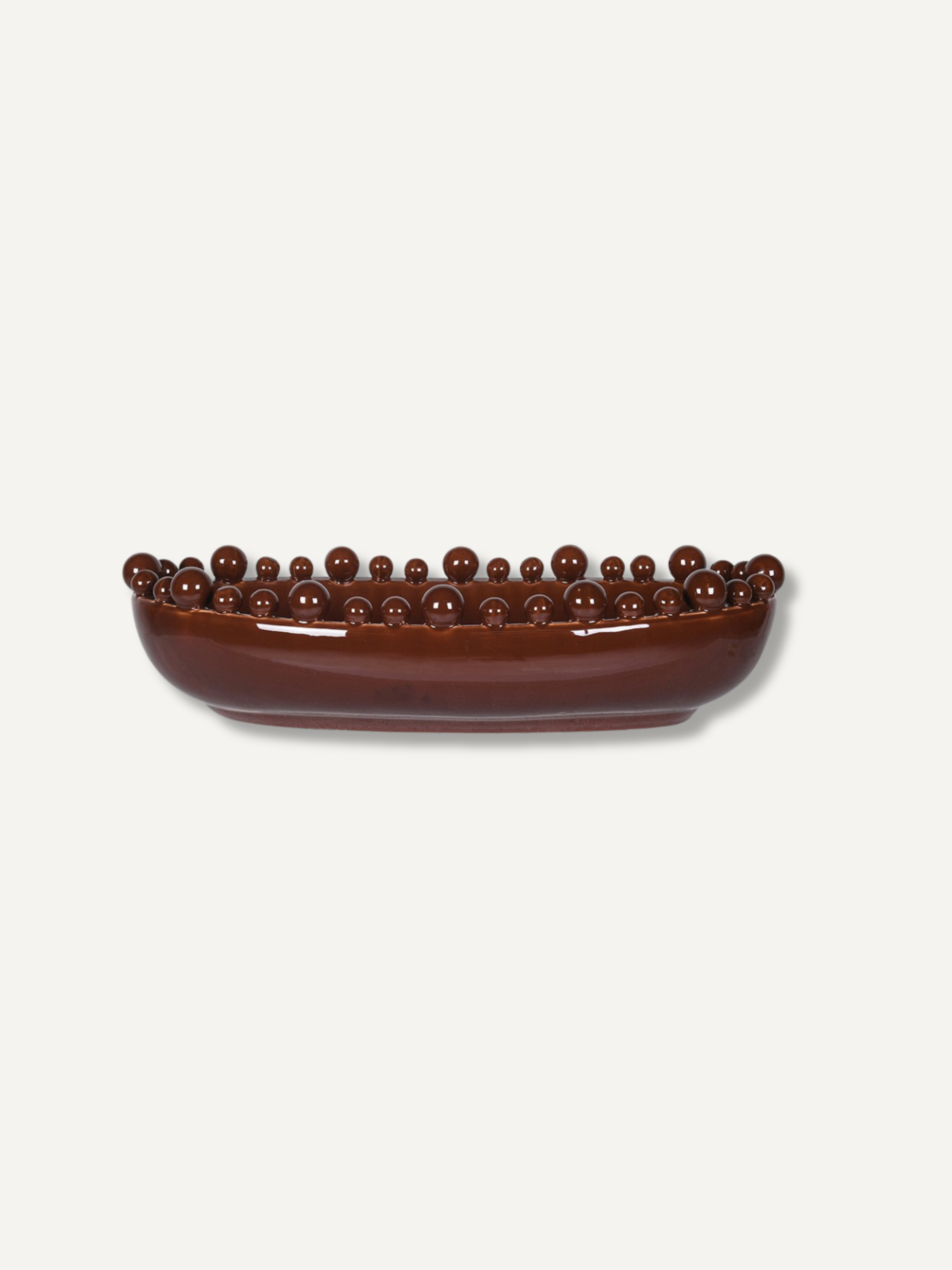A glossy dark brown ceramic bowl with a raised rim of small spherical beads, shown on a plain light gray background.