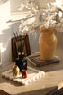Vintage inspired coffee table styling with ochre vase and faux honest sprays