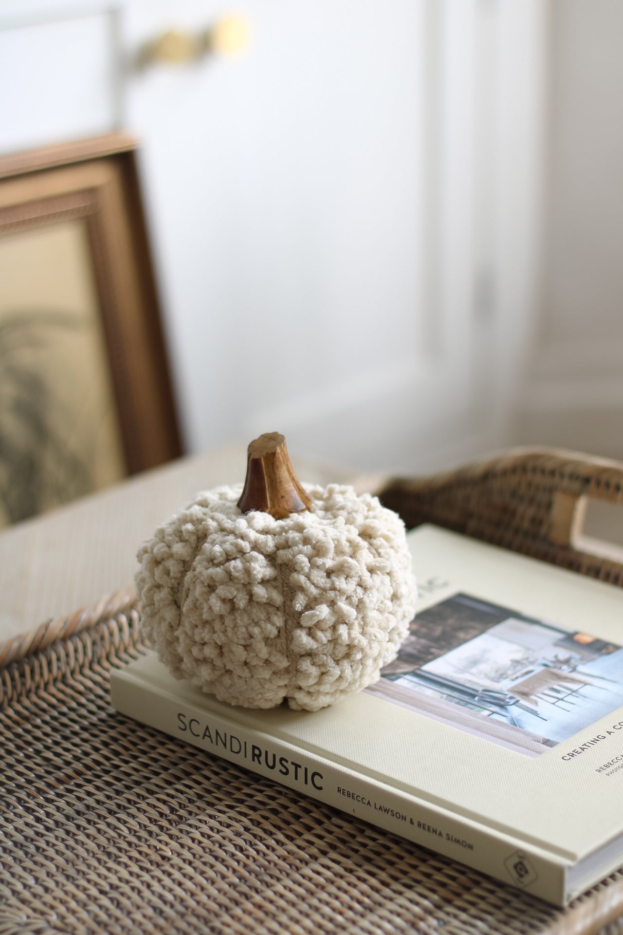 curly neutral fabric pumpkin with wooden stalk