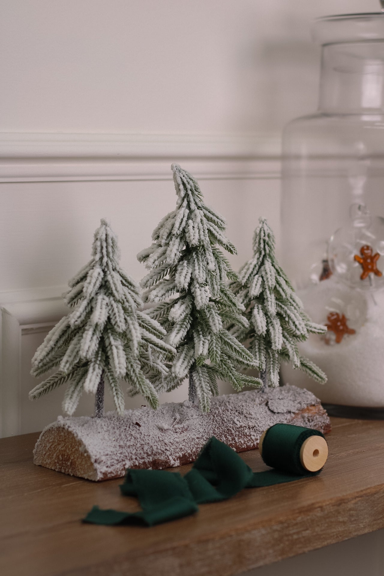 Snowy Faux Christmas Trees on a Rustic Log