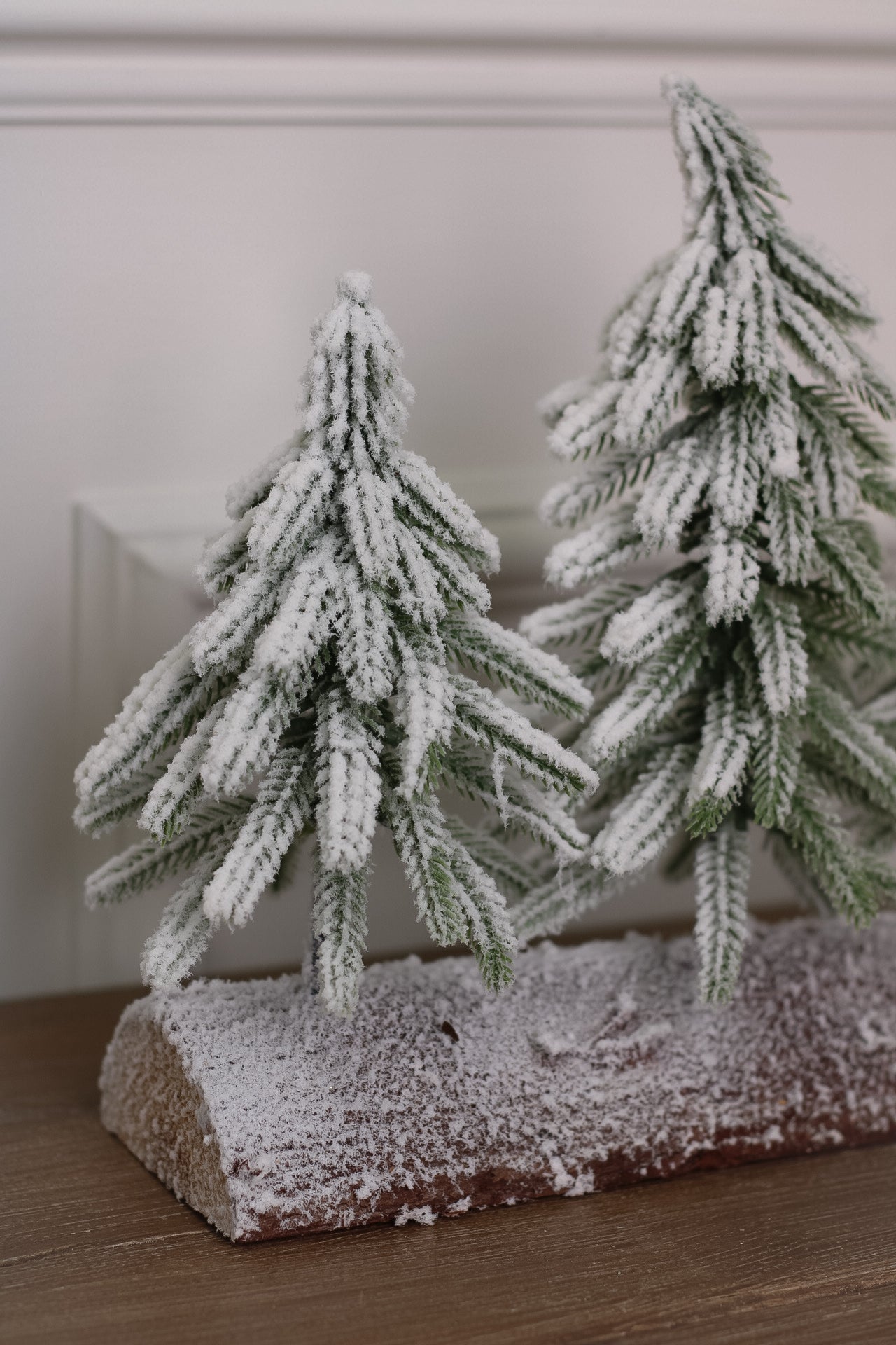 Snowy Faux Christmas Trees on a Rustic Log