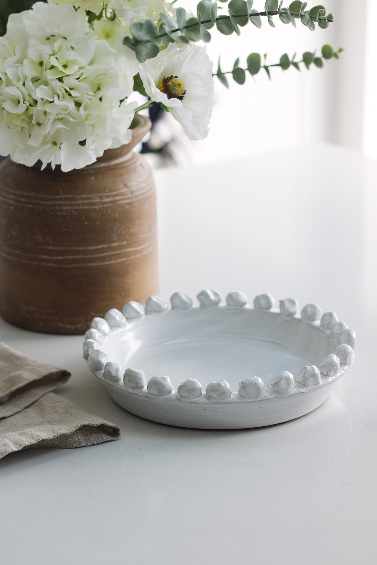 Distressed White Bobble Bowl on kitchen worktop