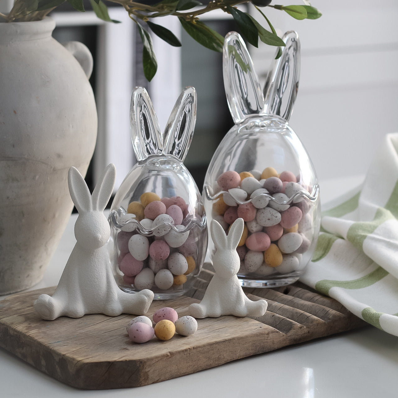 white bunnies sat on a vintage washboard