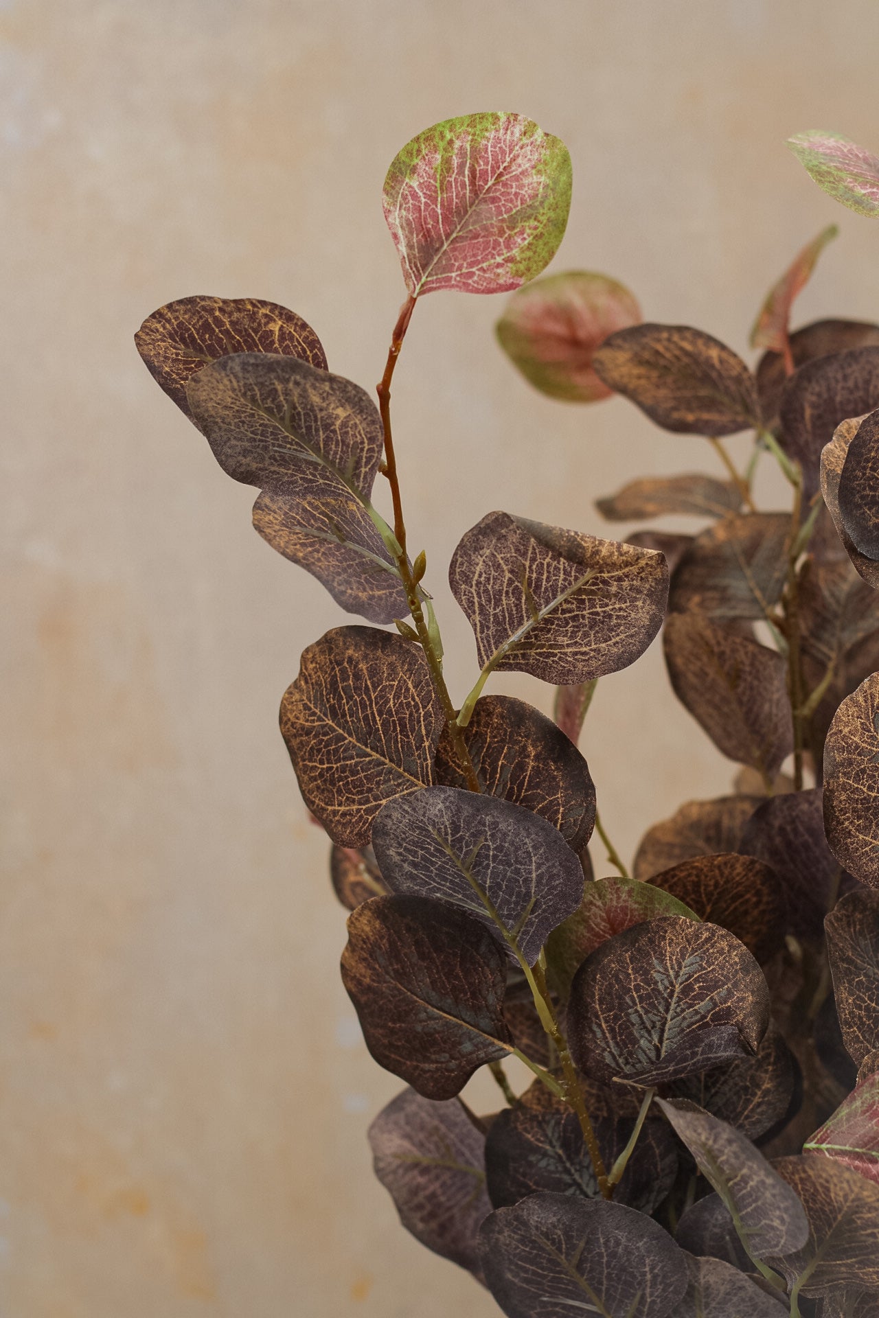 up close of faux autumn eucalyptus stem