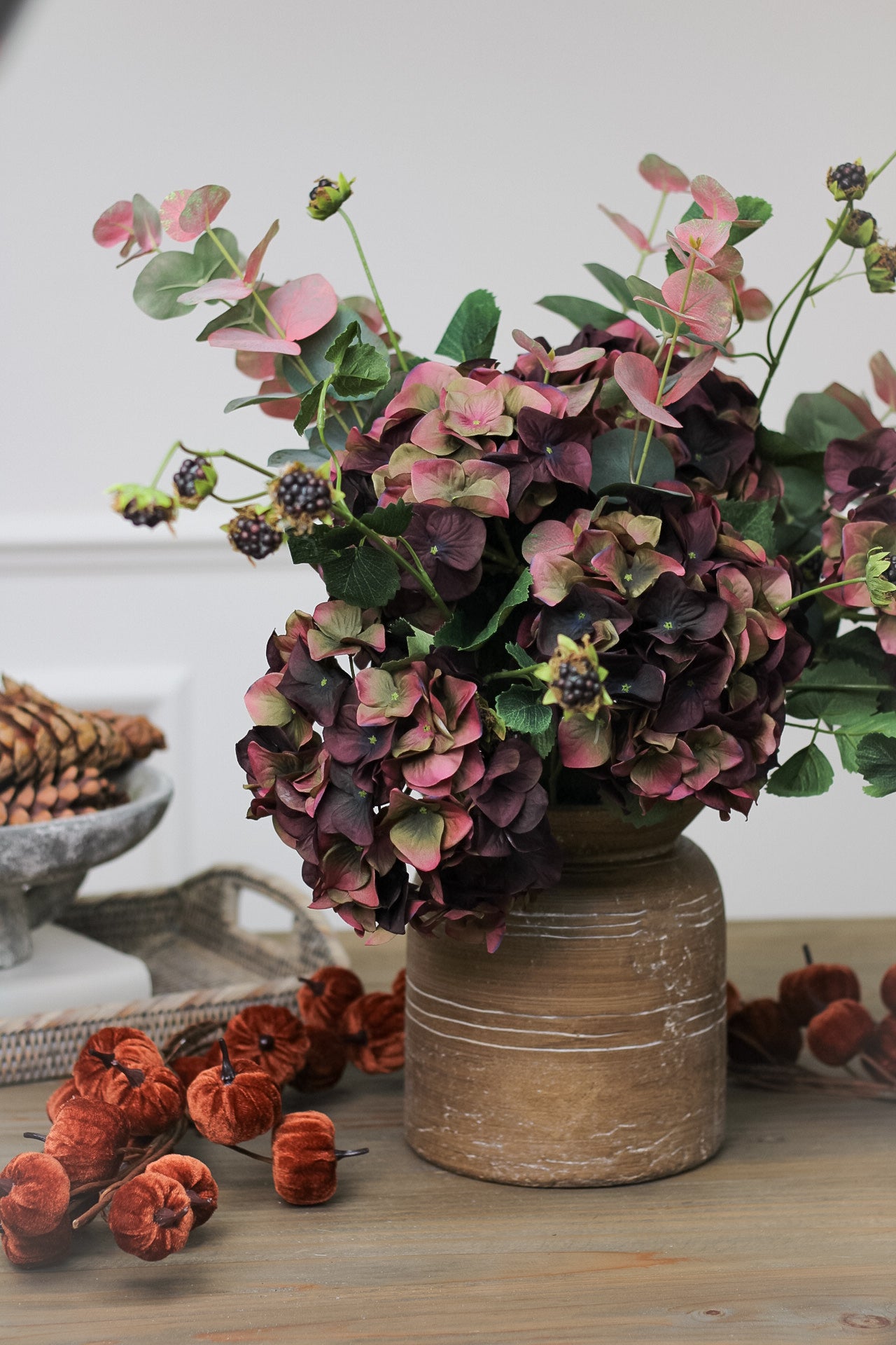 faux rich fig and olive hydrangea arrangement in brown cement distressed vase