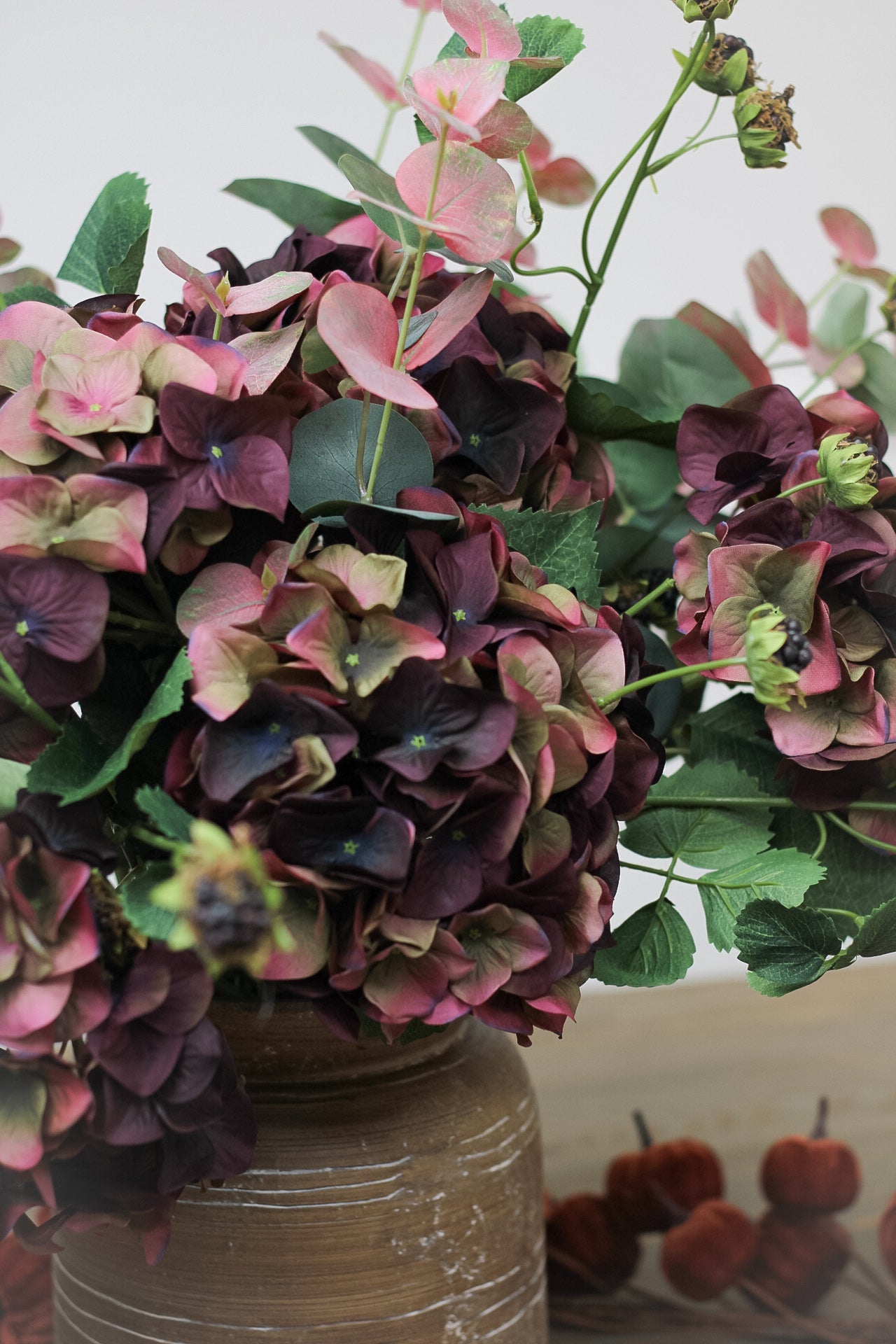 faux burgundy hydrangea with blackberries and blush eucalyptus arrangement