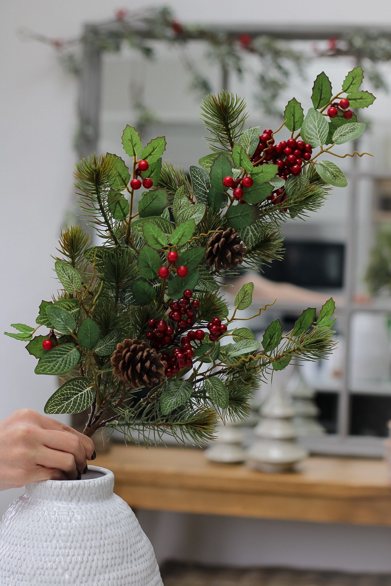 Faux pine and red berry christmas foliage
