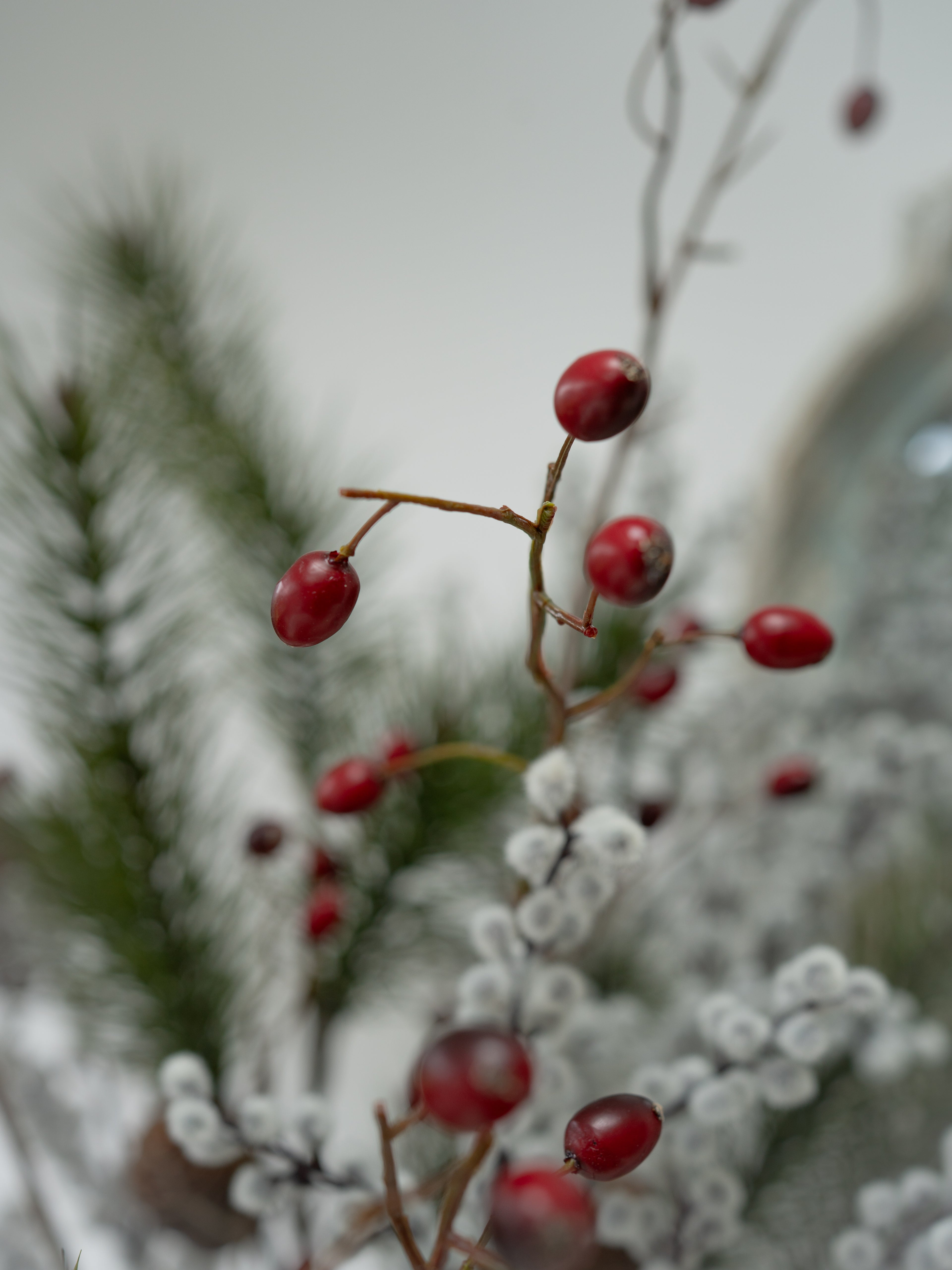 Faux Pine, Snowy Berry and Rosehip Branches Floral Arrangement