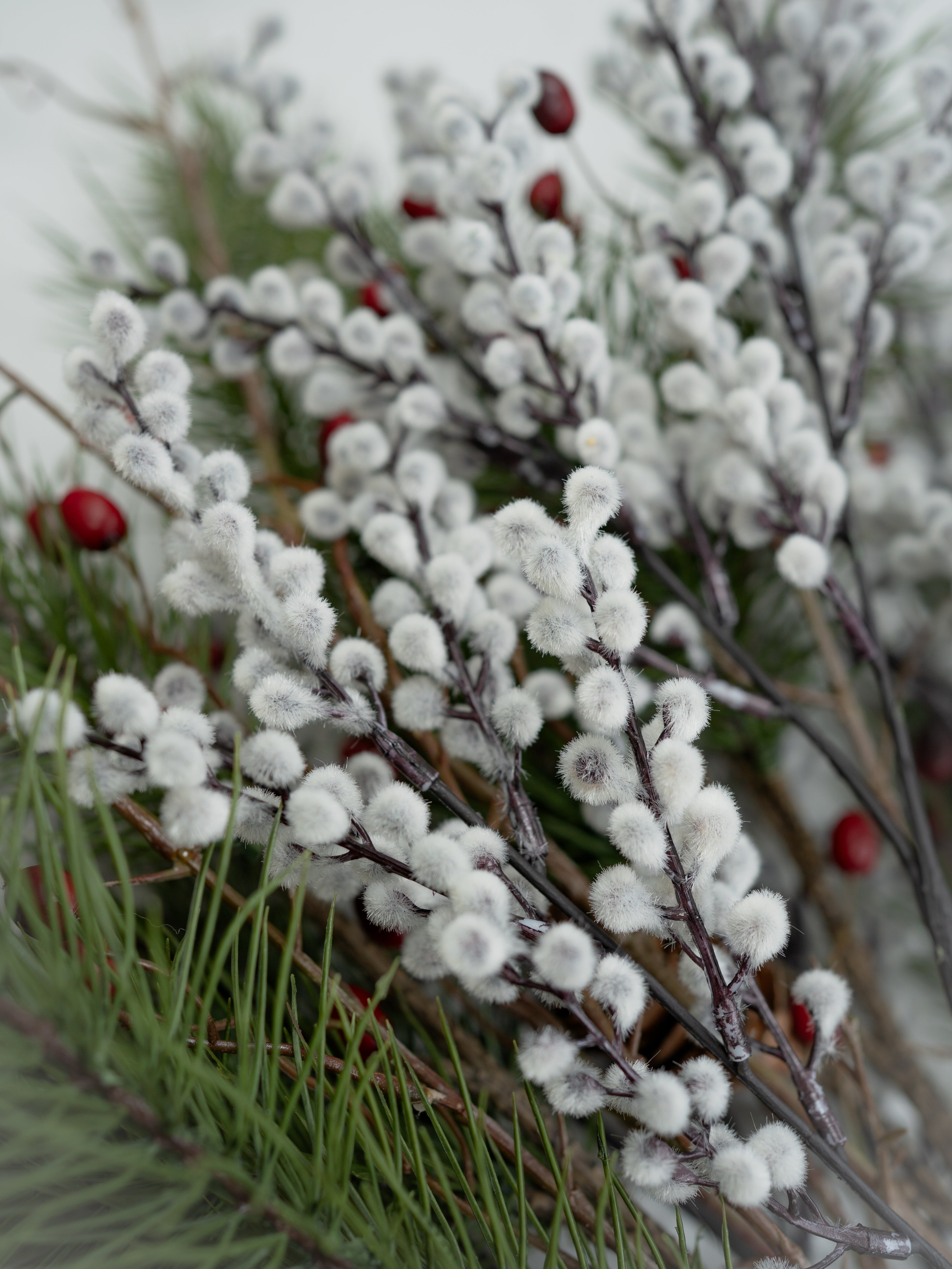 Faux Pine, Snowy Berry and Rosehip Branches Floral Arrangement