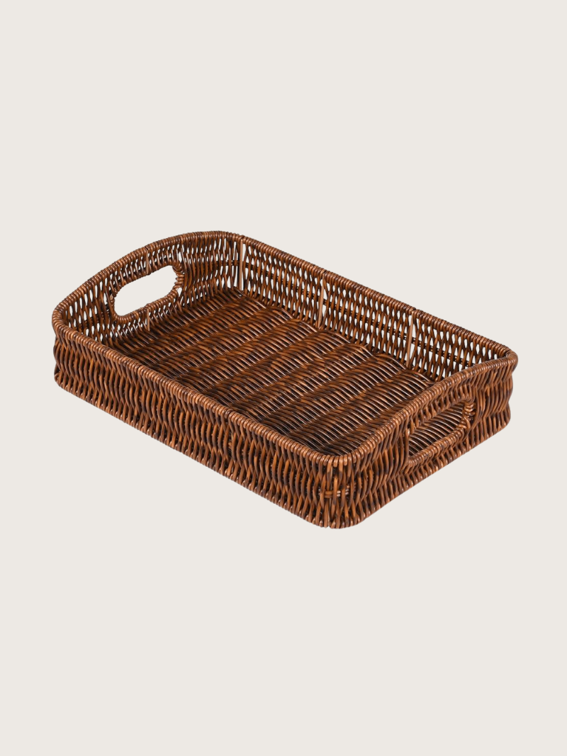 Woven brown tray on a light beige background