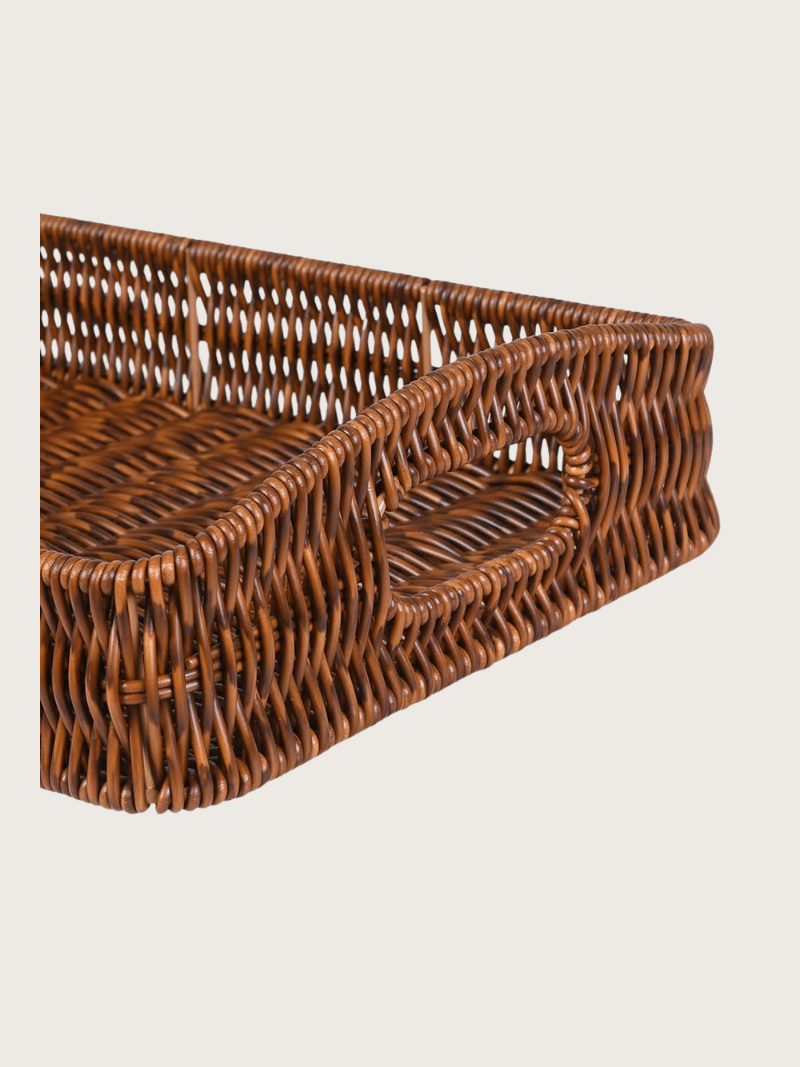 Woven brown basket on a light beige background