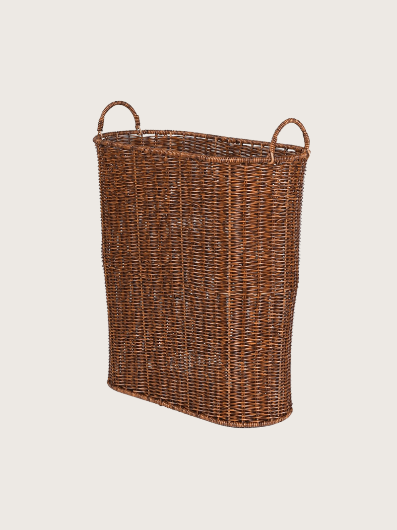 Wicker umbrella basket on a light beige background