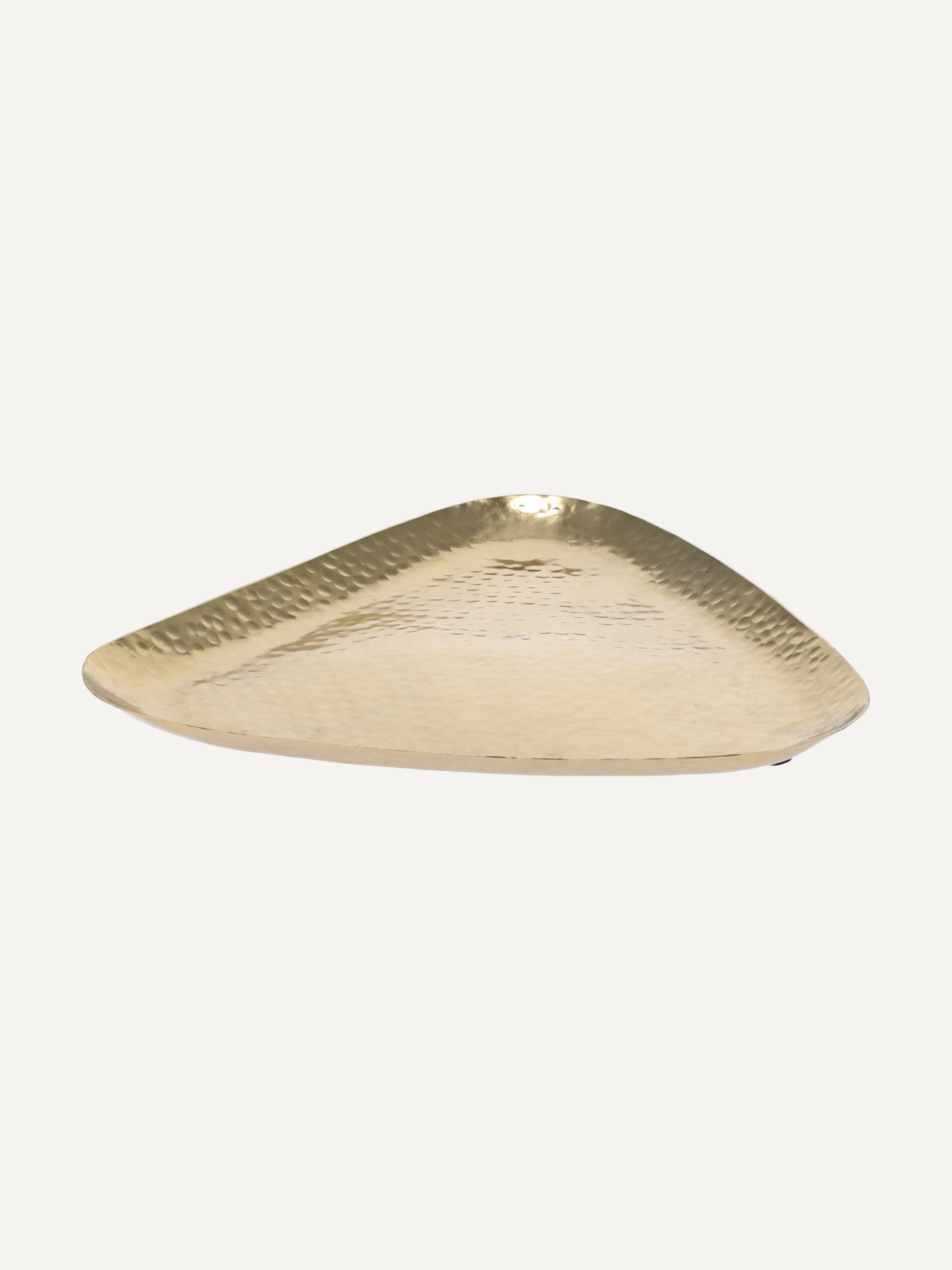 A triangular gold-toned tray with a hammered texture, photographed on a solid off-white background.