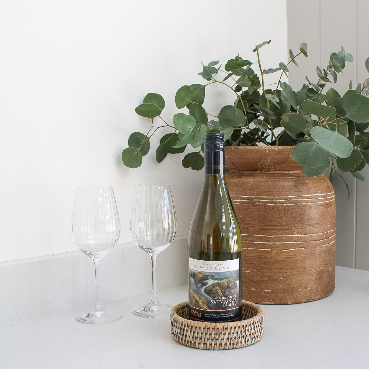 Grey washed coaster for wine bottle