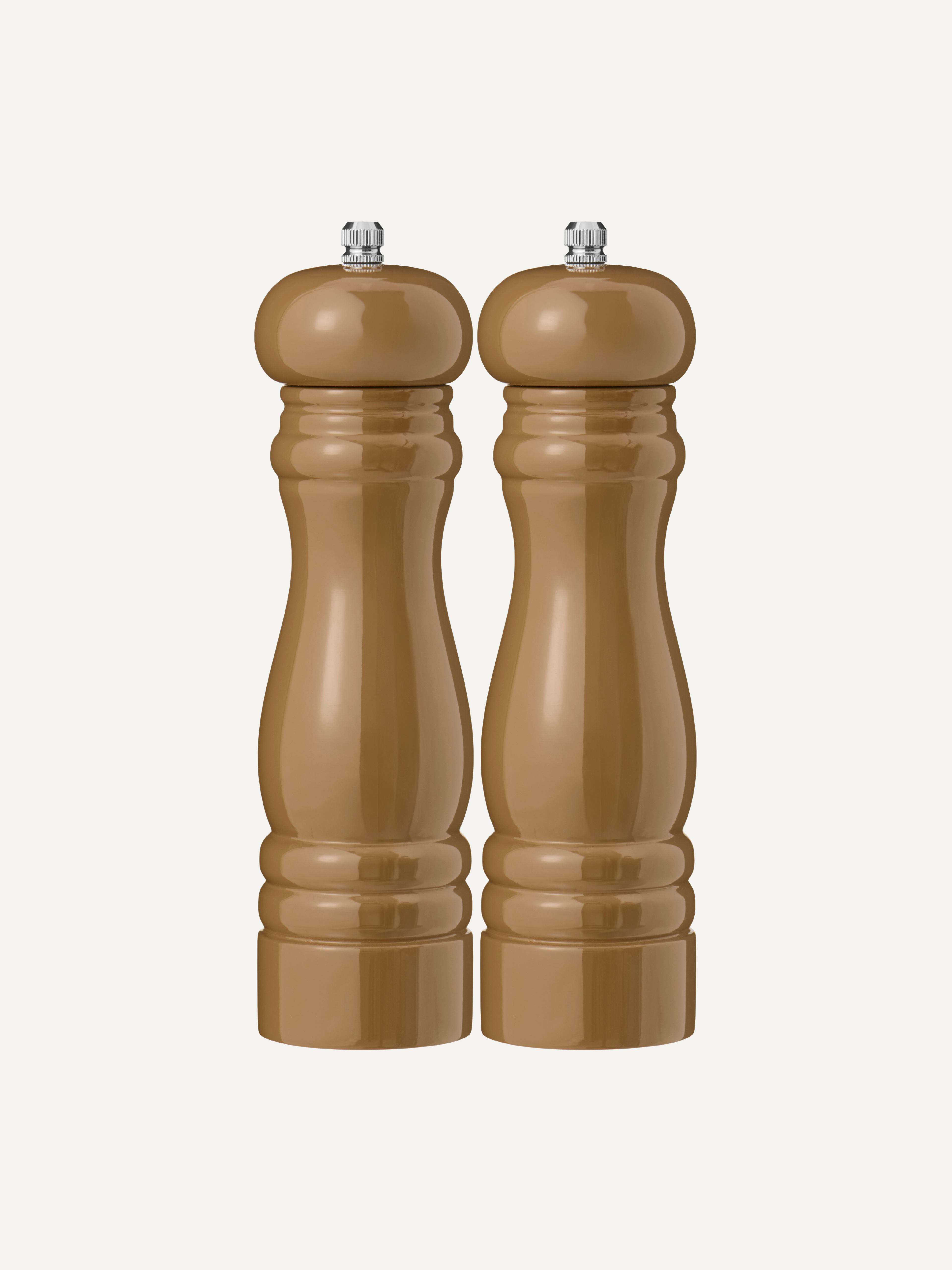 Two glossy brown wooden pepper mills with silver metal tops, standing side-by-side against a plain off-white background.