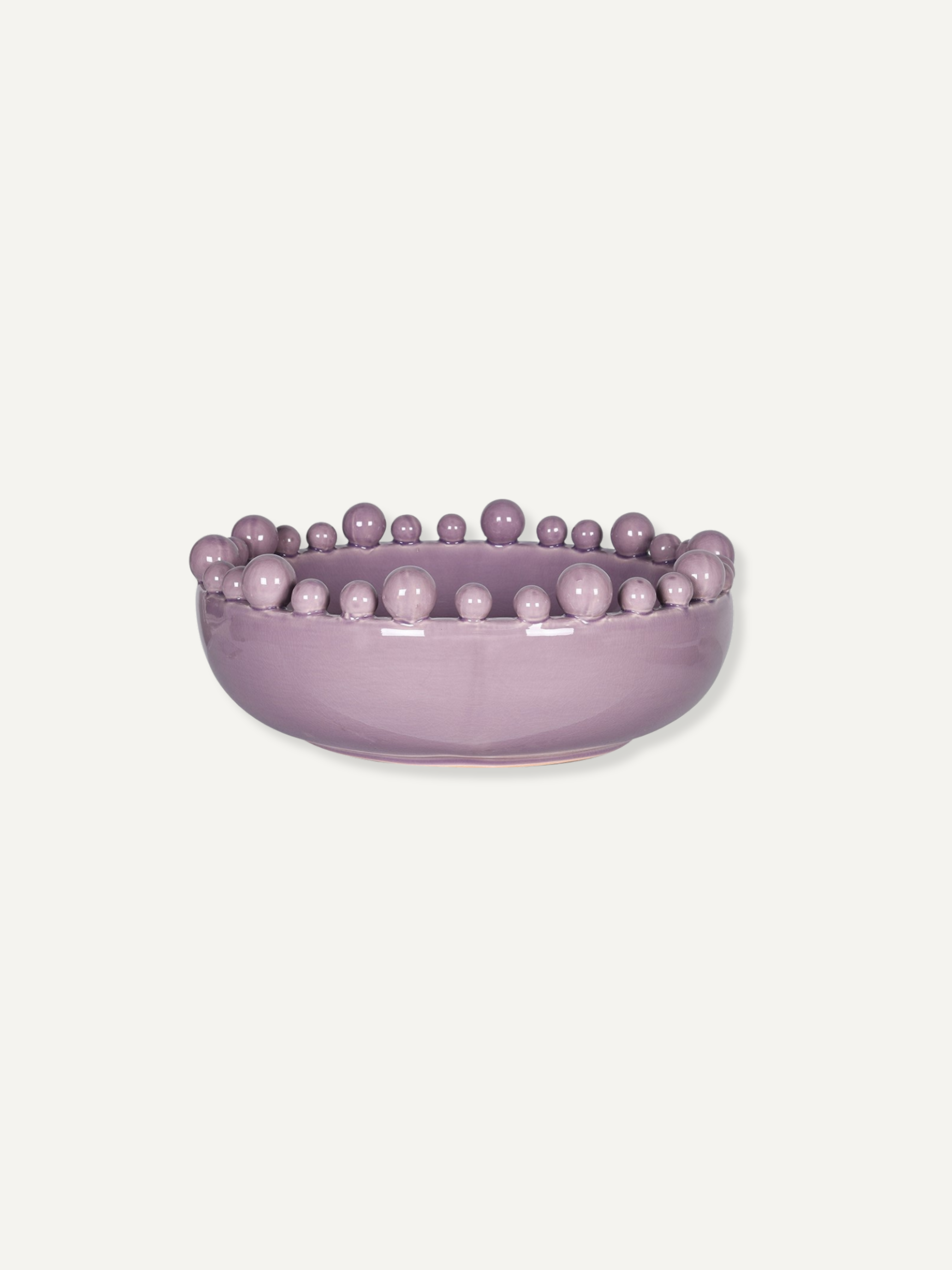 A lavender purple ceramic bowl featuring a raised border of small, evenly spaced decorative beads, shown against a solid off-white background.
