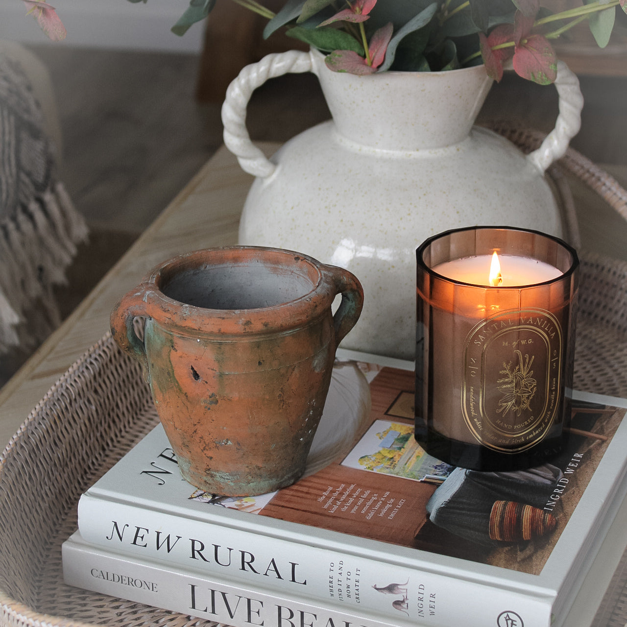 mini vintage olive pot on coffee table with candle in brown glass pot