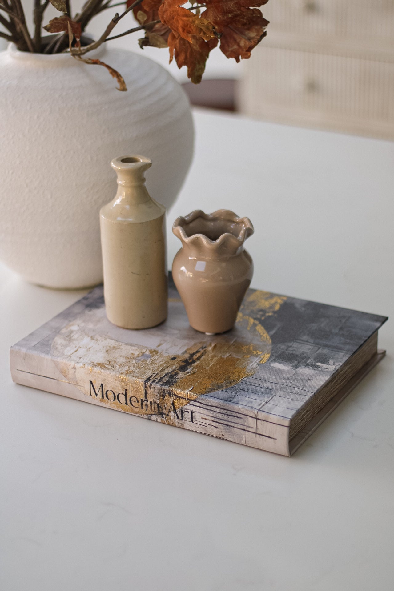 Moonlight Modern Art Storage Book Box with small vase with fluted edge and cream ink pourer bottle