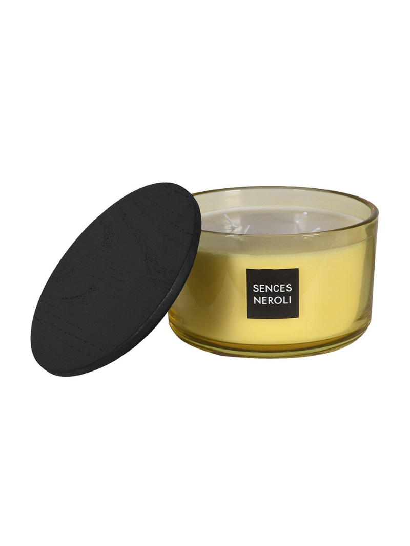 Yellow candle with black lid and &