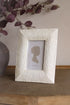 Decorative photo frame with a silhouette on a textured surface