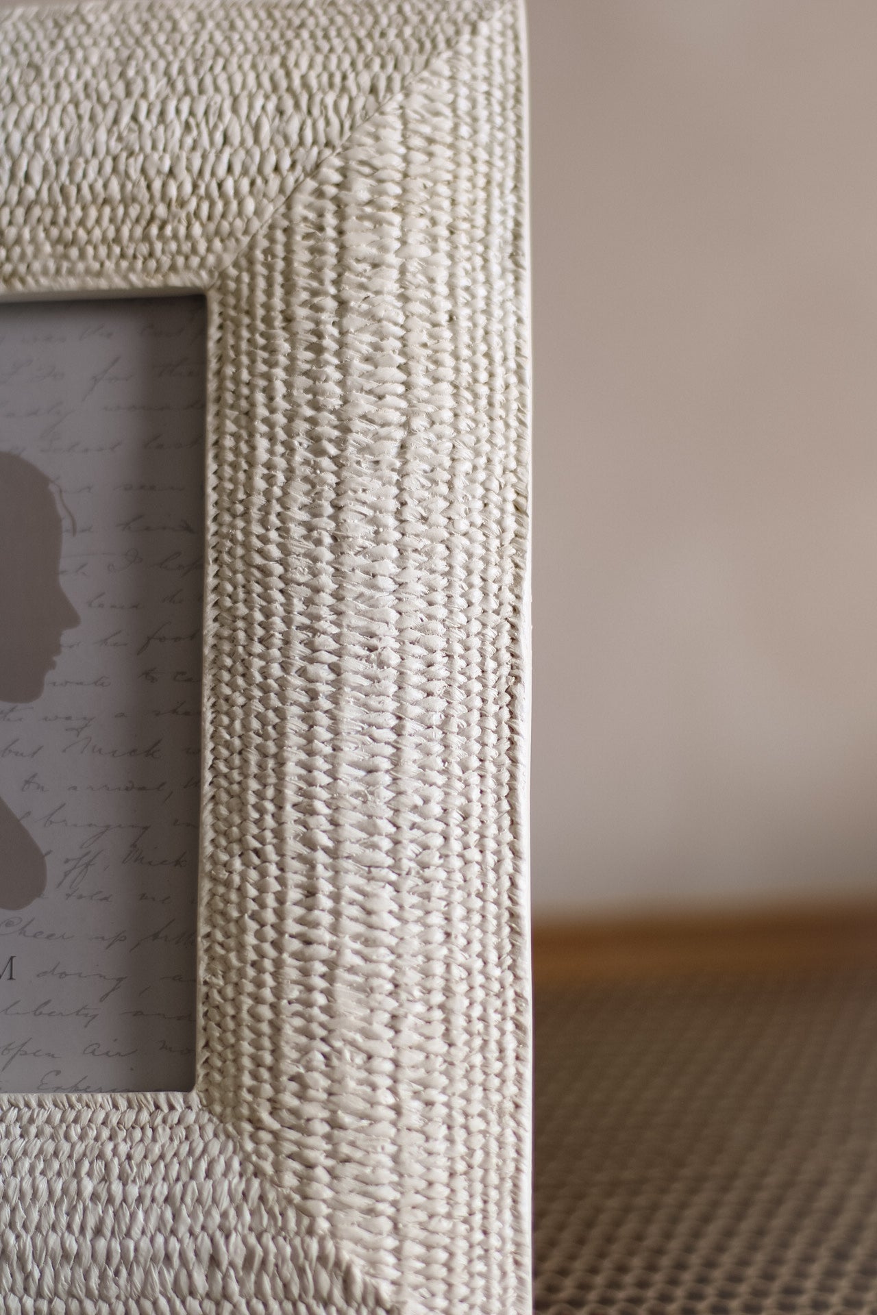 Close-up of a textured picture frame with a blurred background