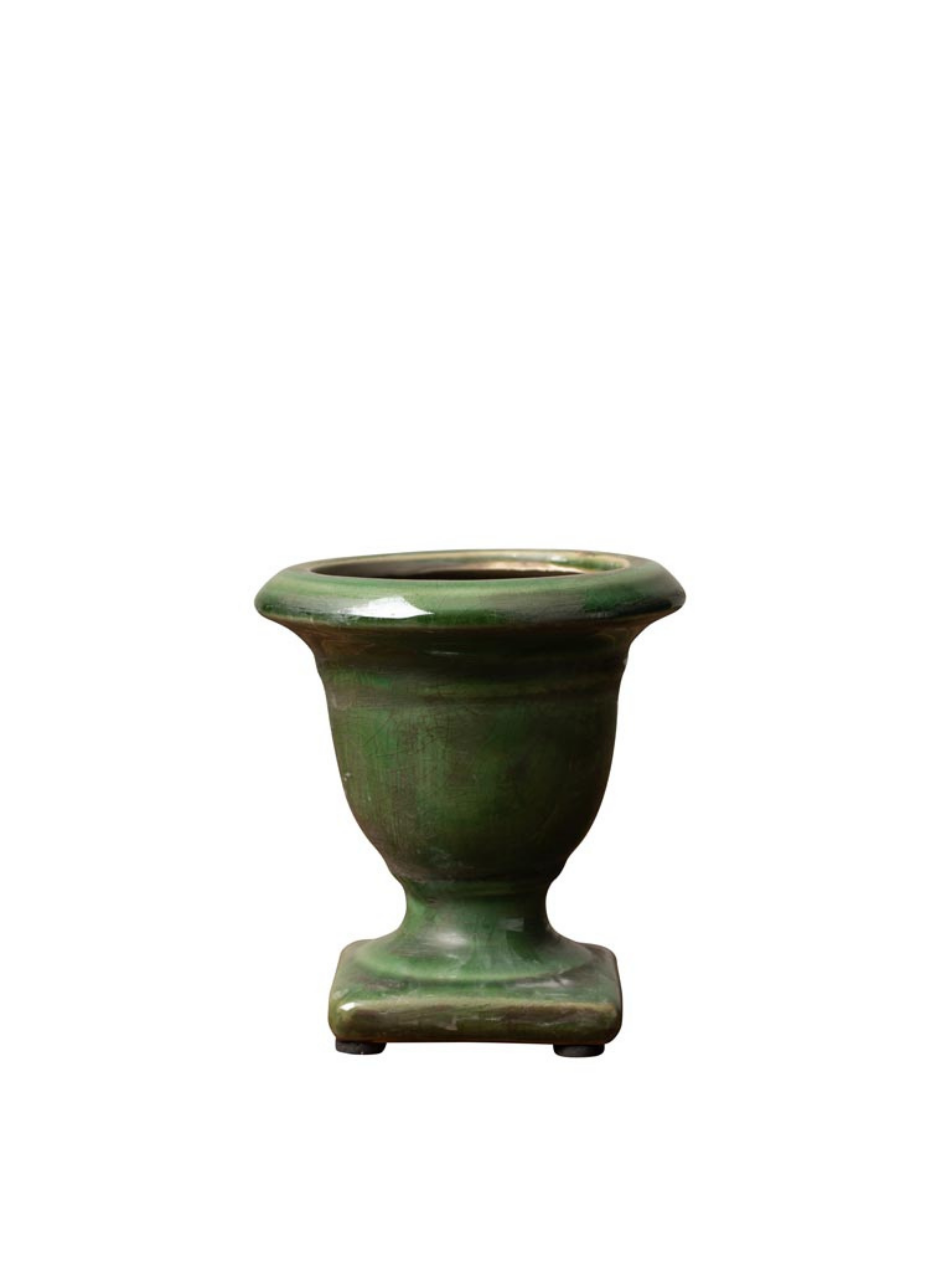 Green ceramic urn on a white background