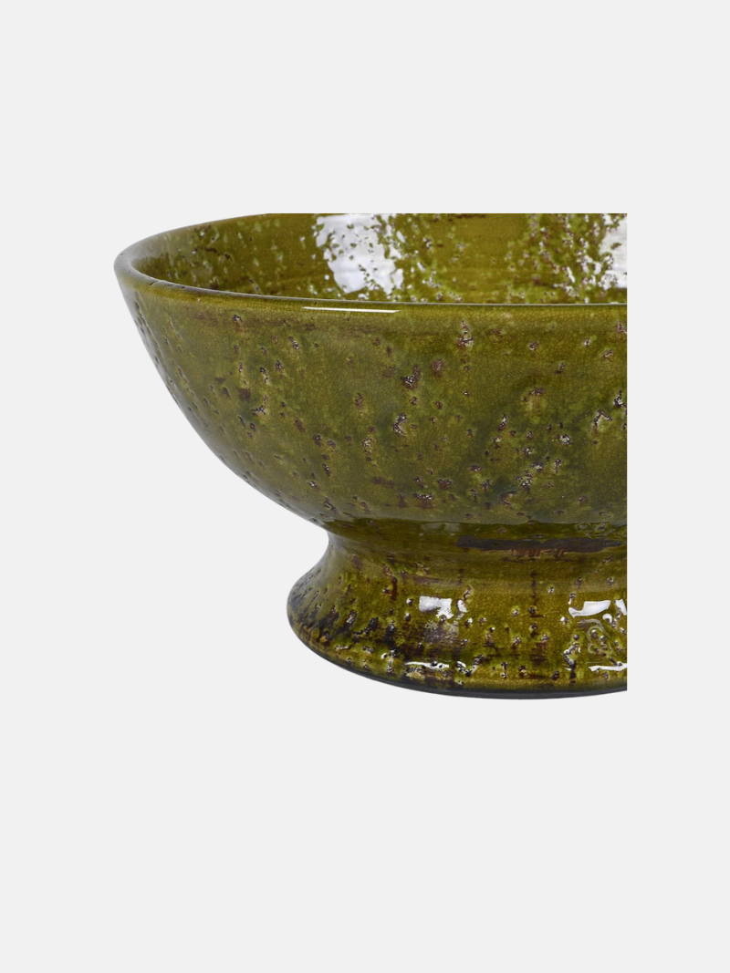 Green ceramic bowl on a white background