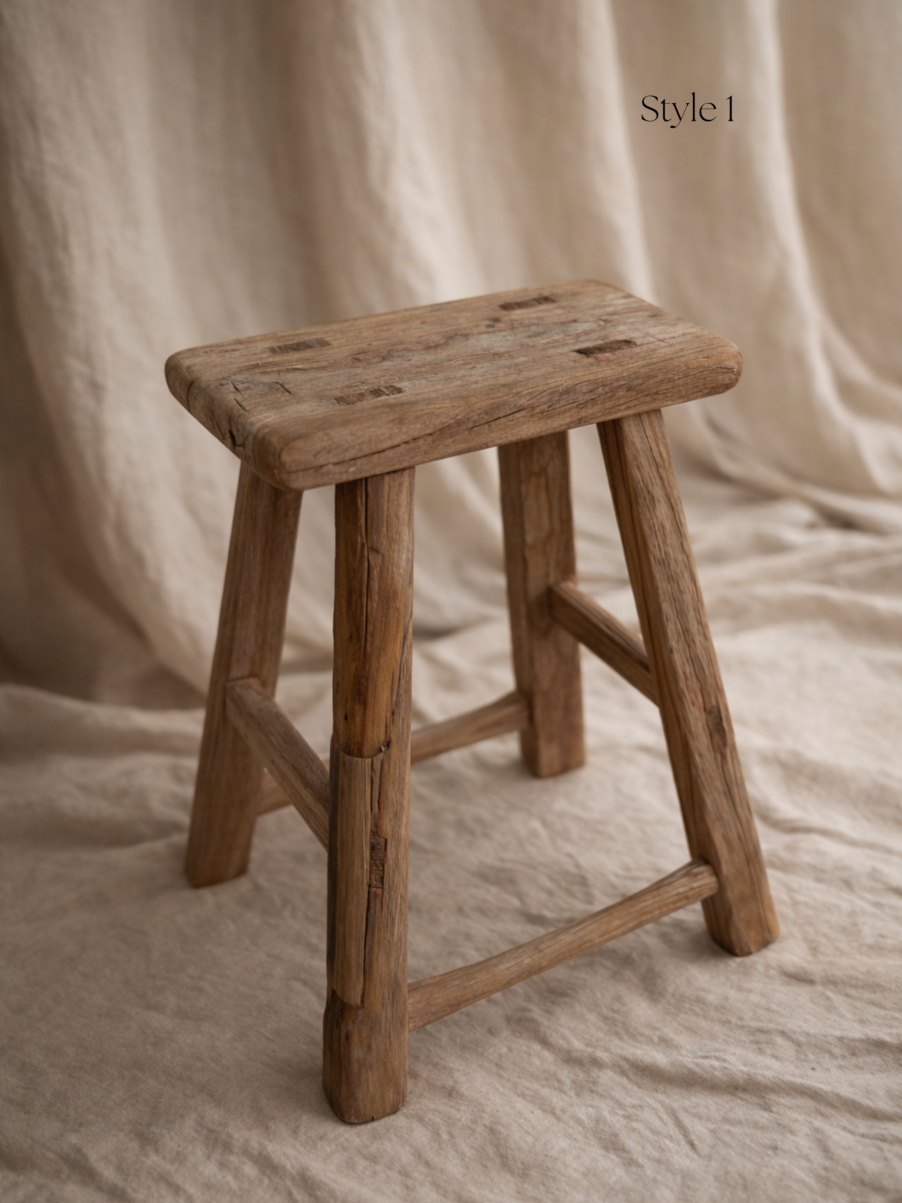Wooden stool on a beige fabric background for home decor