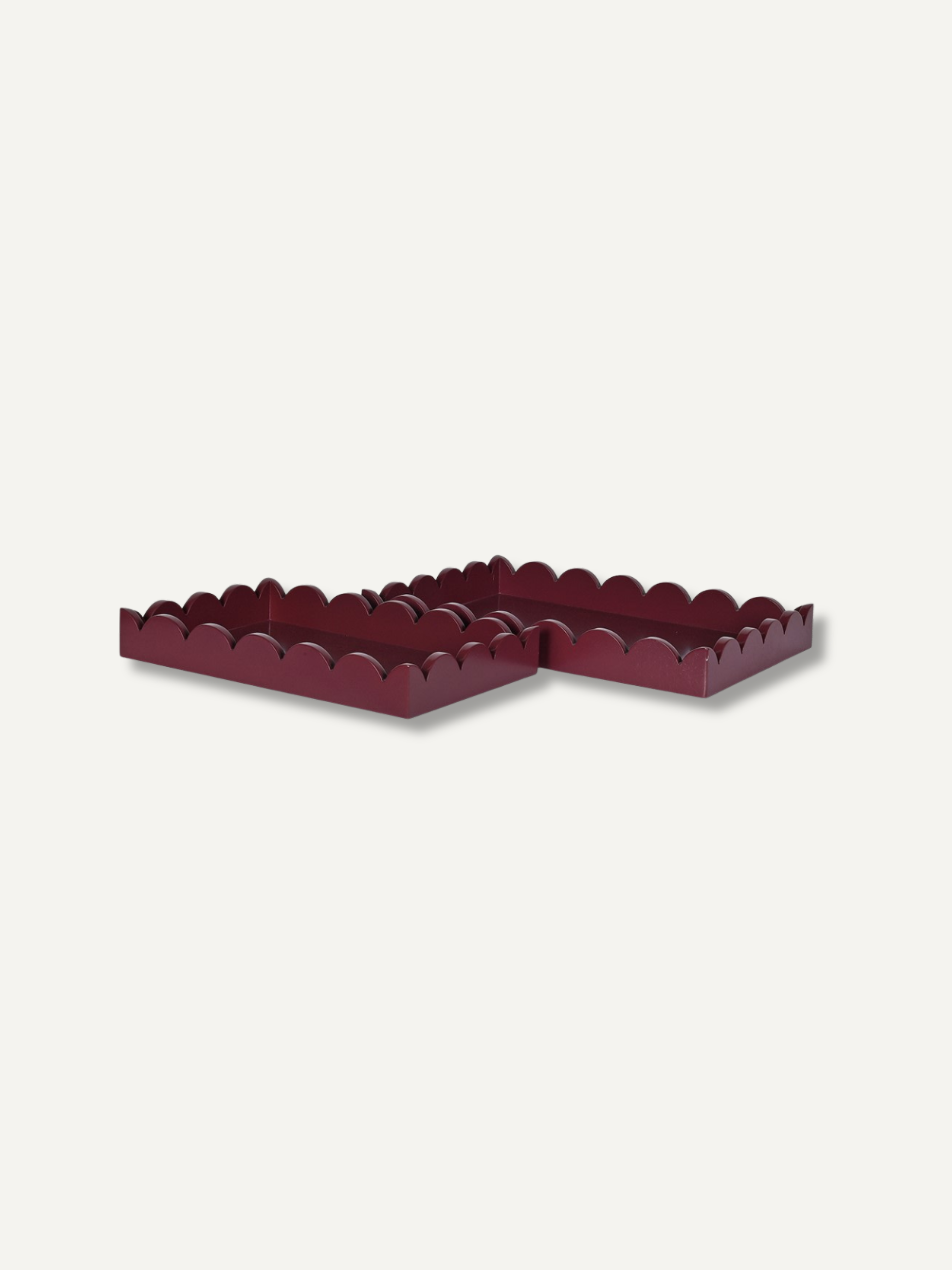 deep burgundy pair of decorative trays with scallop edge detailing side by side