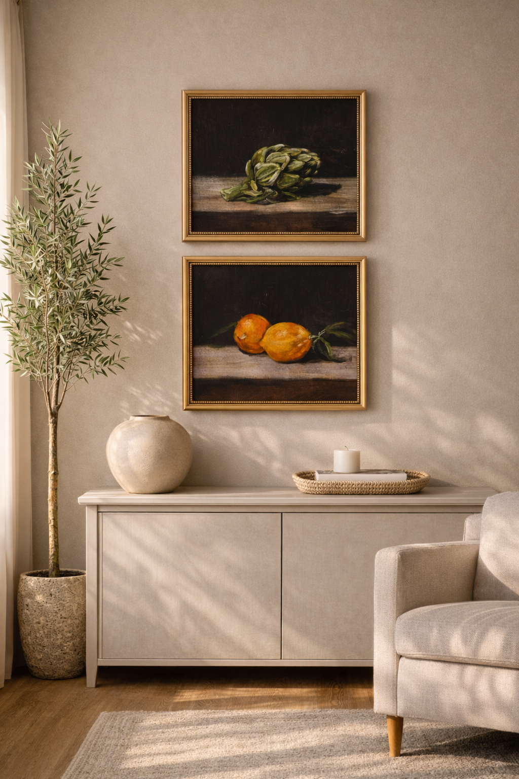 Two framed still life paintings above a cabinet with a plant and chair in a room.