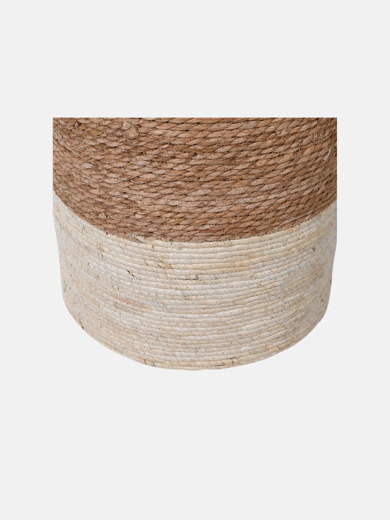 Woven drum stool with two-tone design on a light gray background