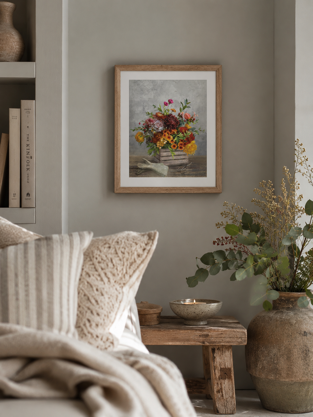 Cosy living room with a winter floral wall art on the wall, wooden bench, and decorative plants.