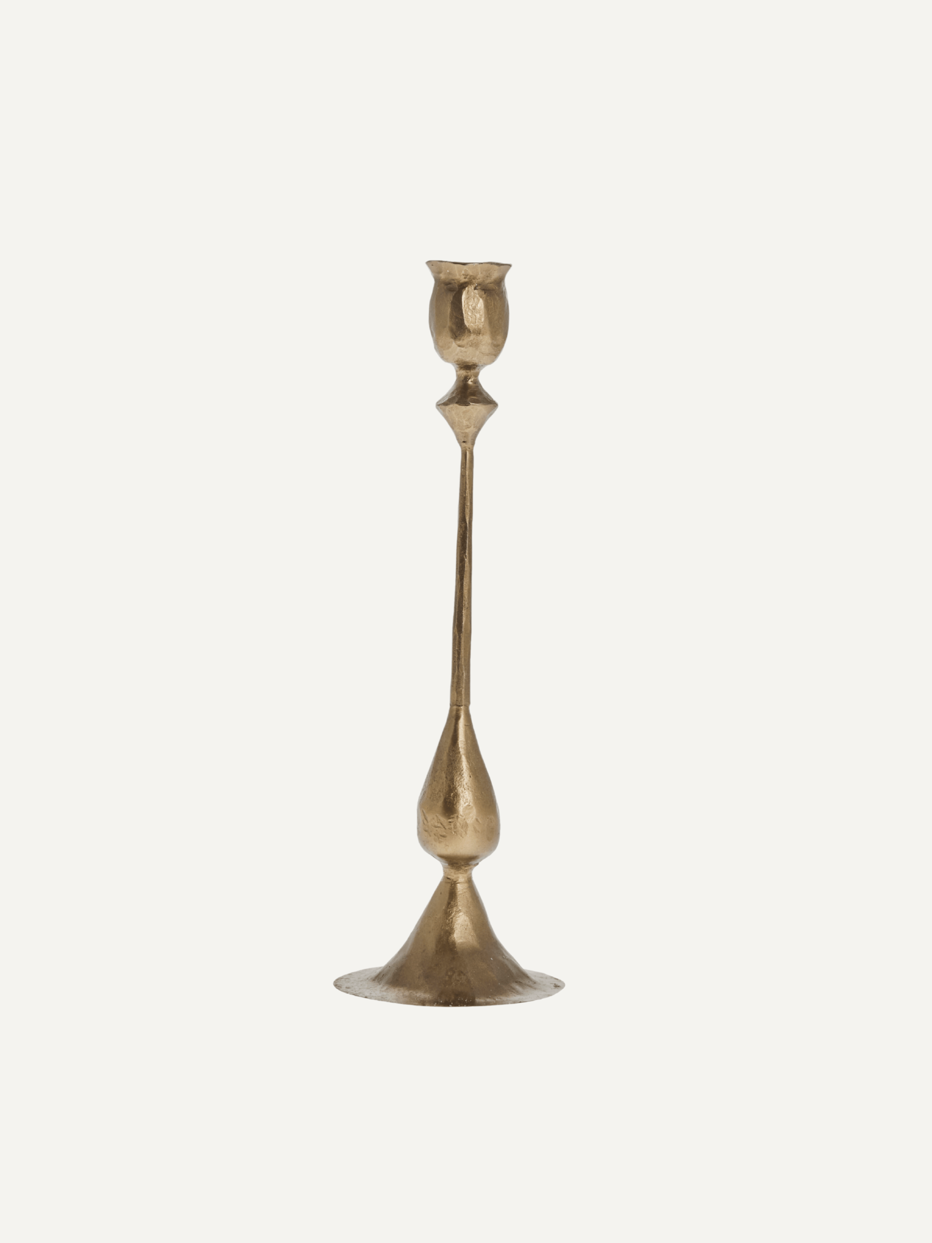 Gold candle stick on a white background