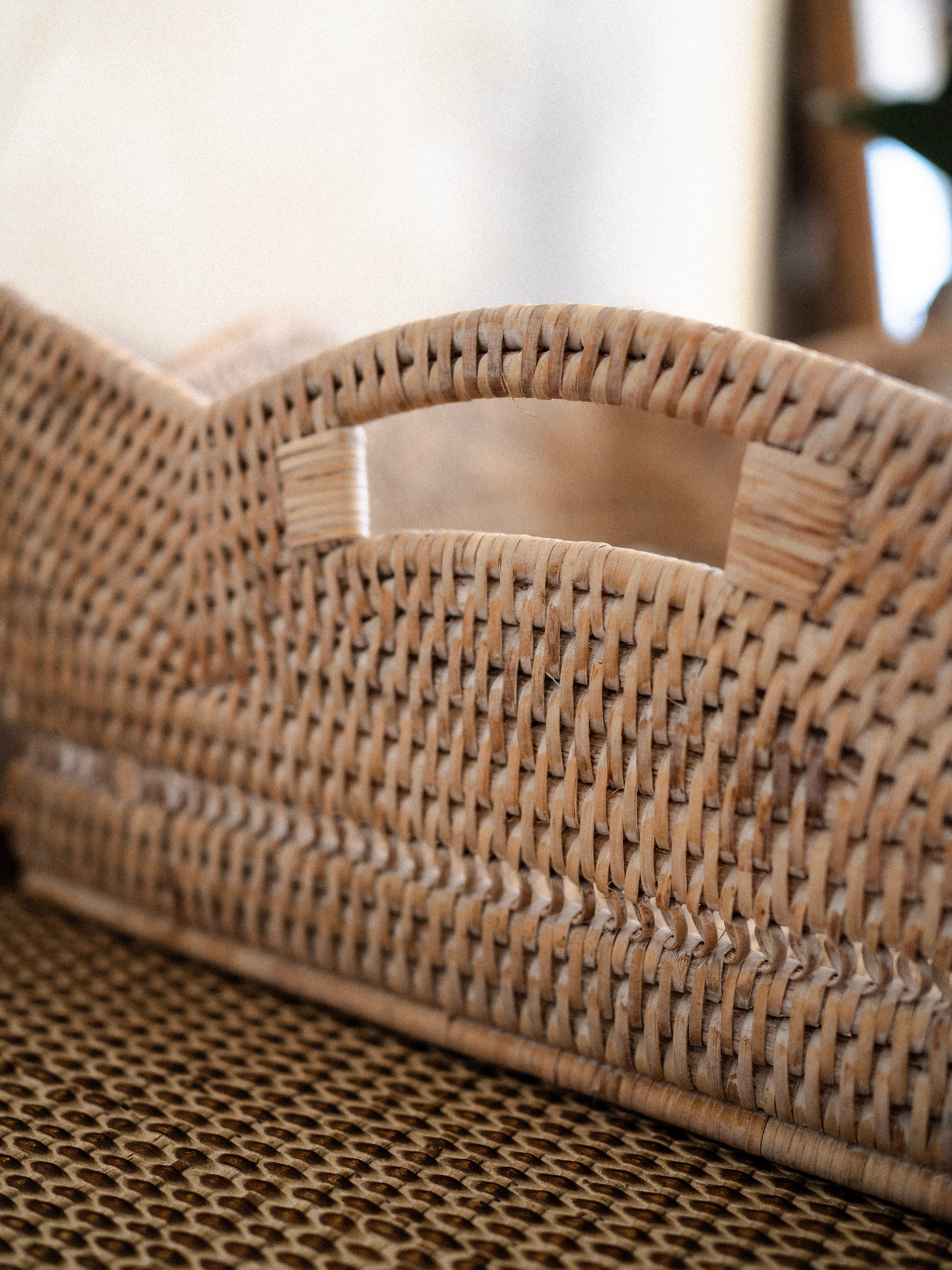 Close-up of a woven basket tray with a blurred background