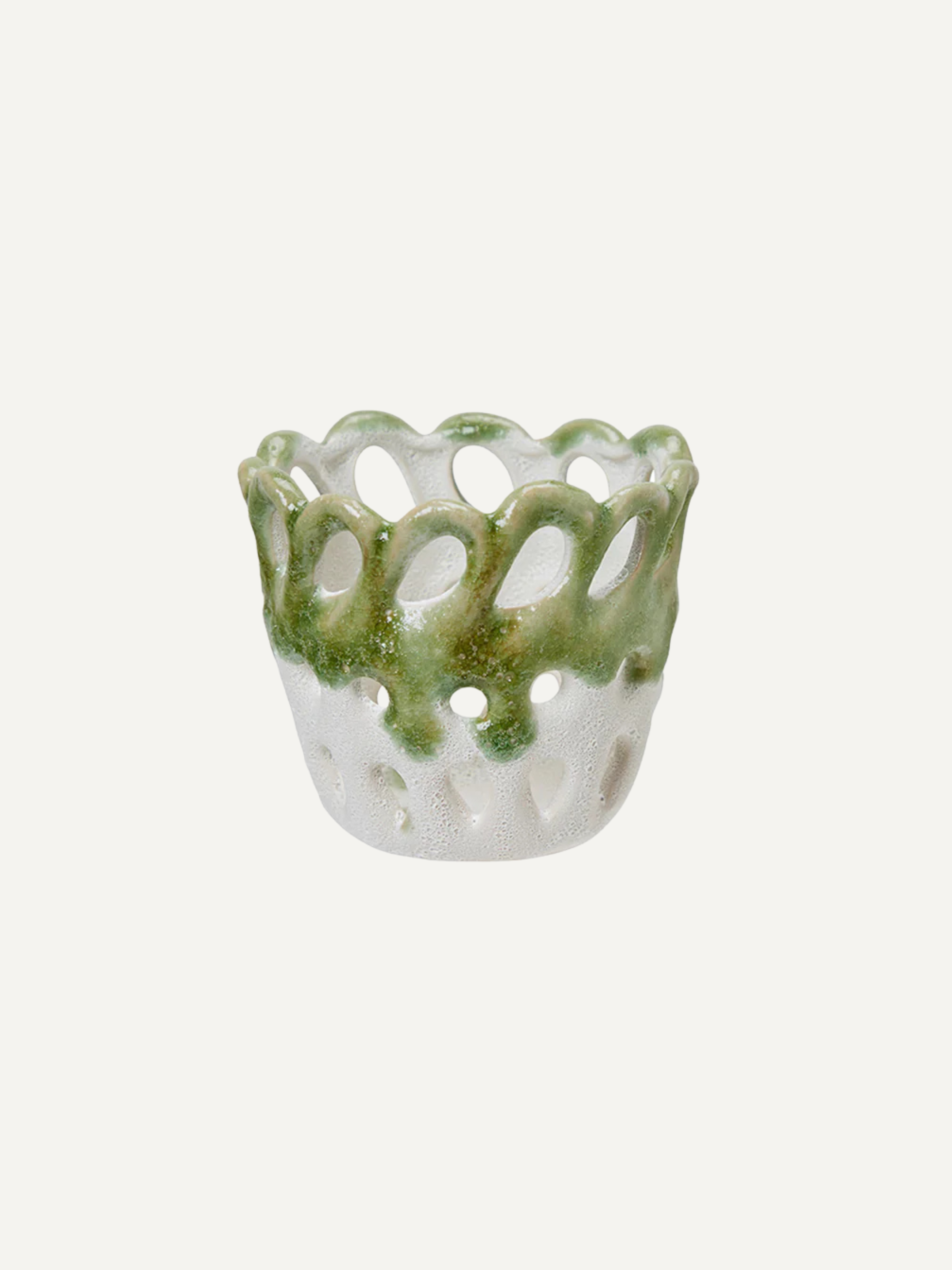 Decorative stoneware candle holder with green top and white base on a light gray background, perfect for tray styling in your home decor