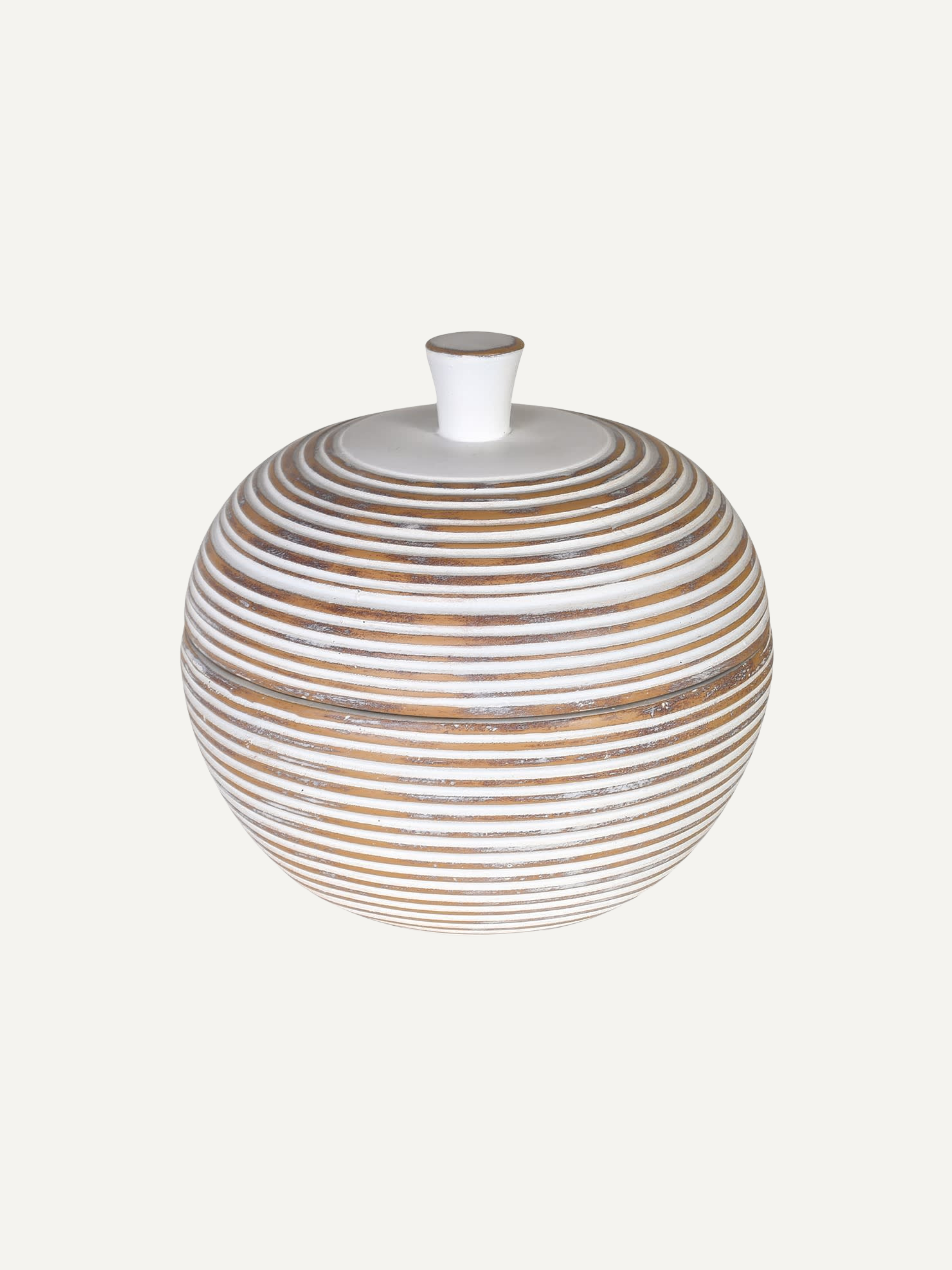Round whitewashed lidded jar with striped design on a white background, perfect for home styling