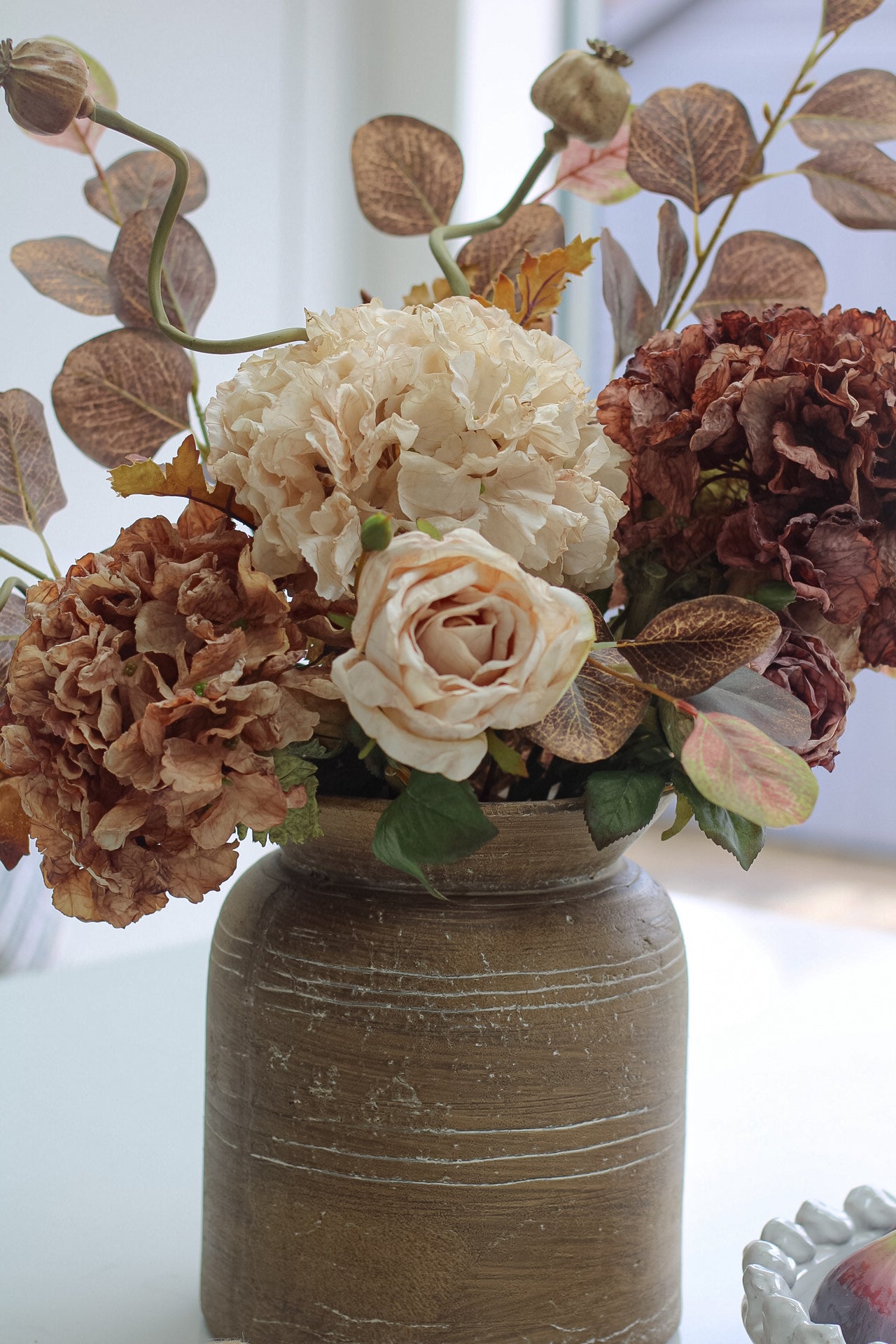 faux earthy floral arrangement